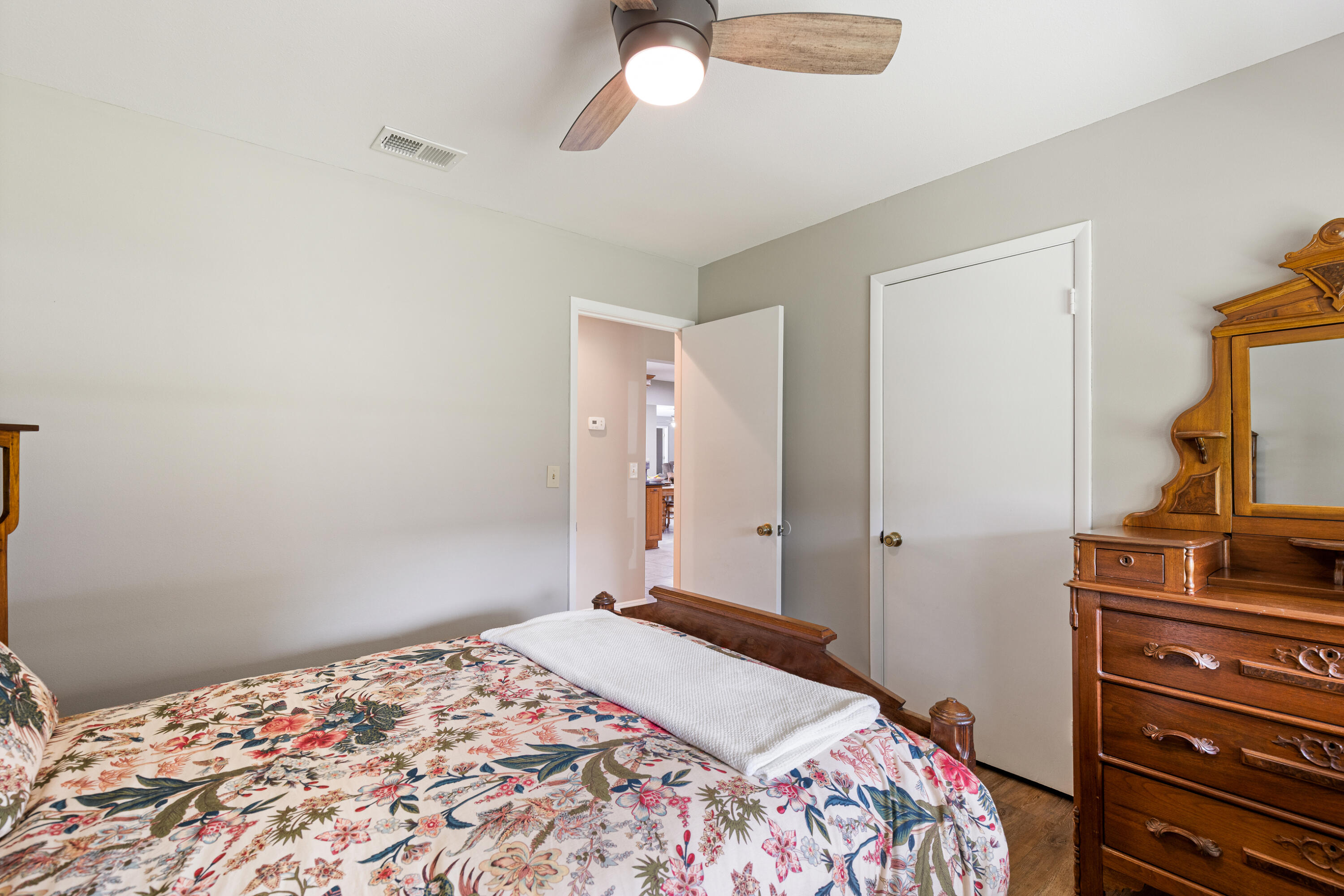 804 Mars Street Destin, FL 32541 - Photo 34 of 71 a bedroom with a bed and a dresser