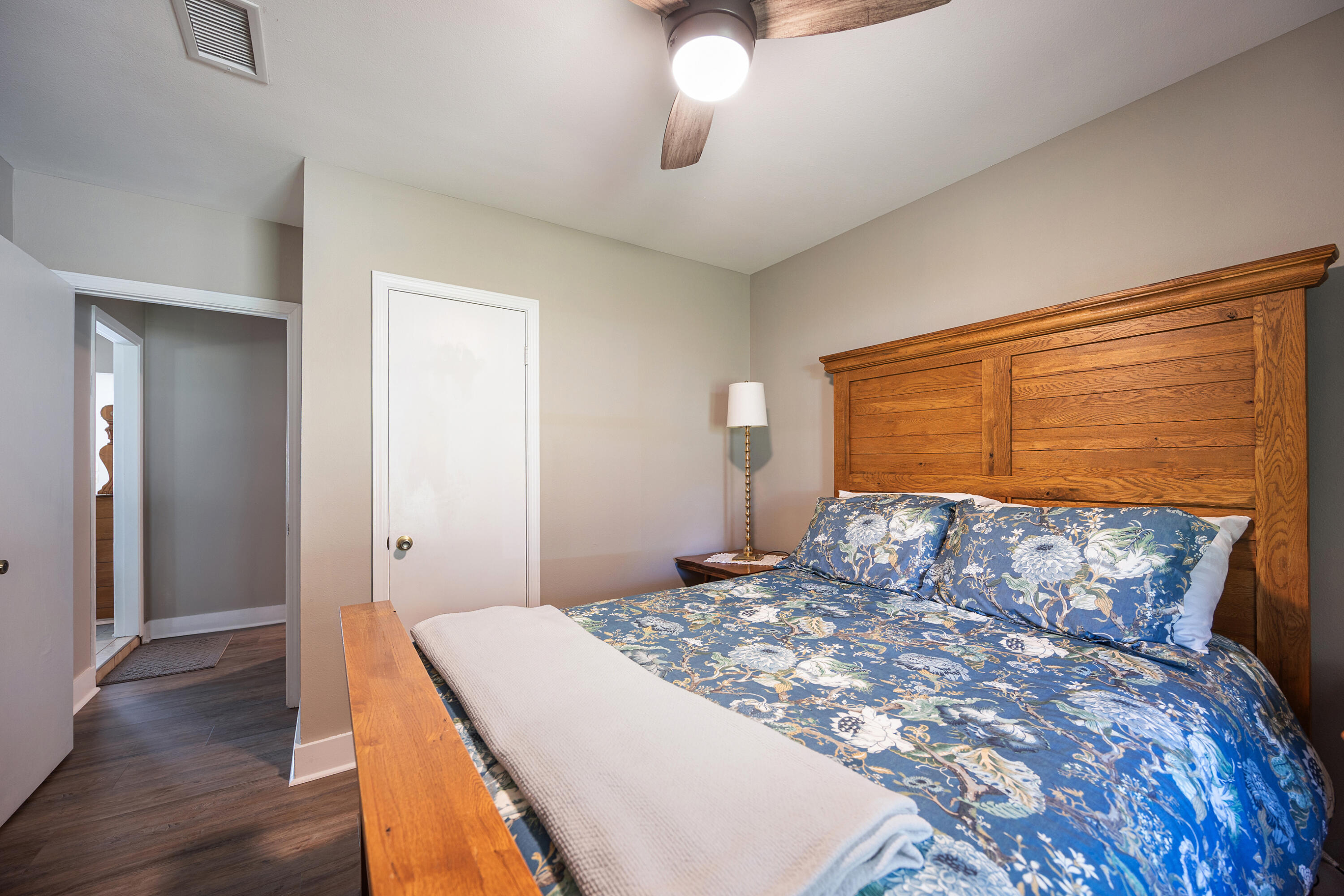 804 Mars Street Destin, FL 32541 - Photo 36 of 71 a bedroom with a large bed and wooden floor
