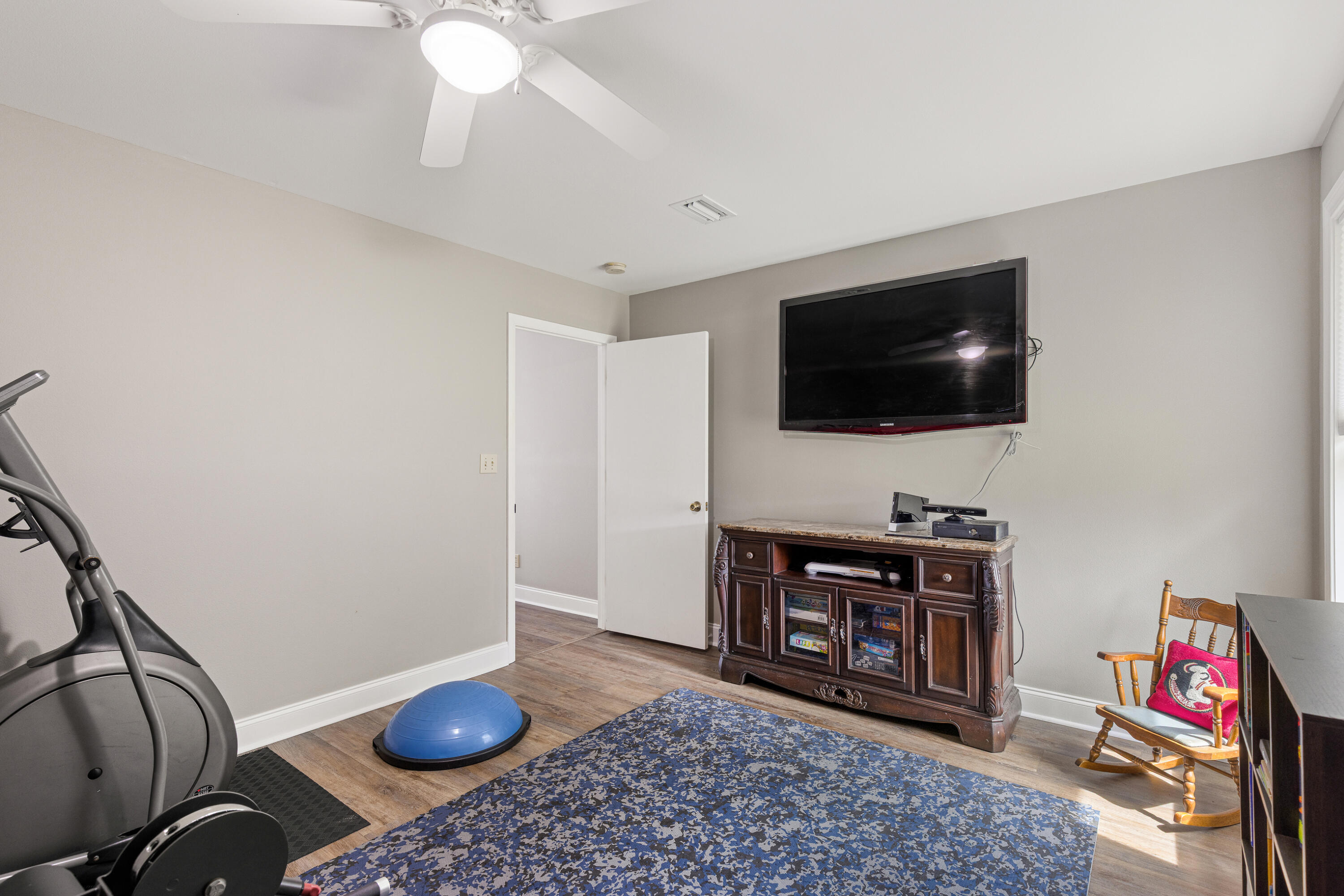 804 Mars Street Destin, FL 32541 - Photo 38 of 71 a living room with furniture and a flat screen tv