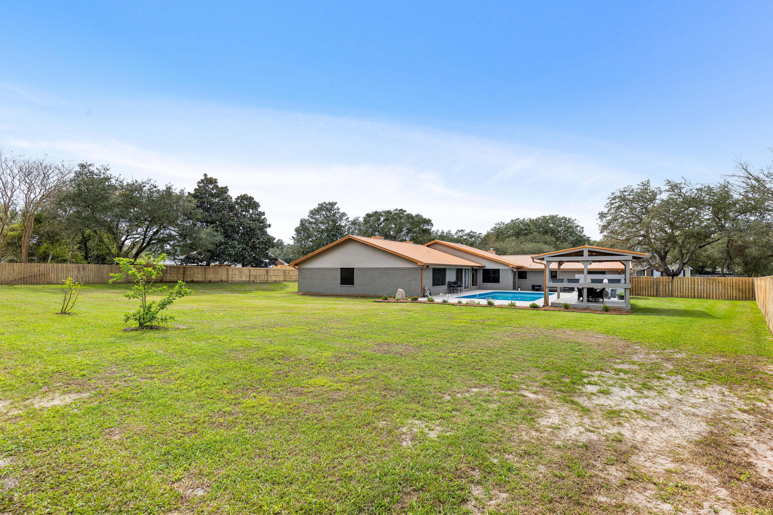 804 Mars Street Destin, FL 32541 - Photo 44 of 71 a front view of a house with a yard and trees