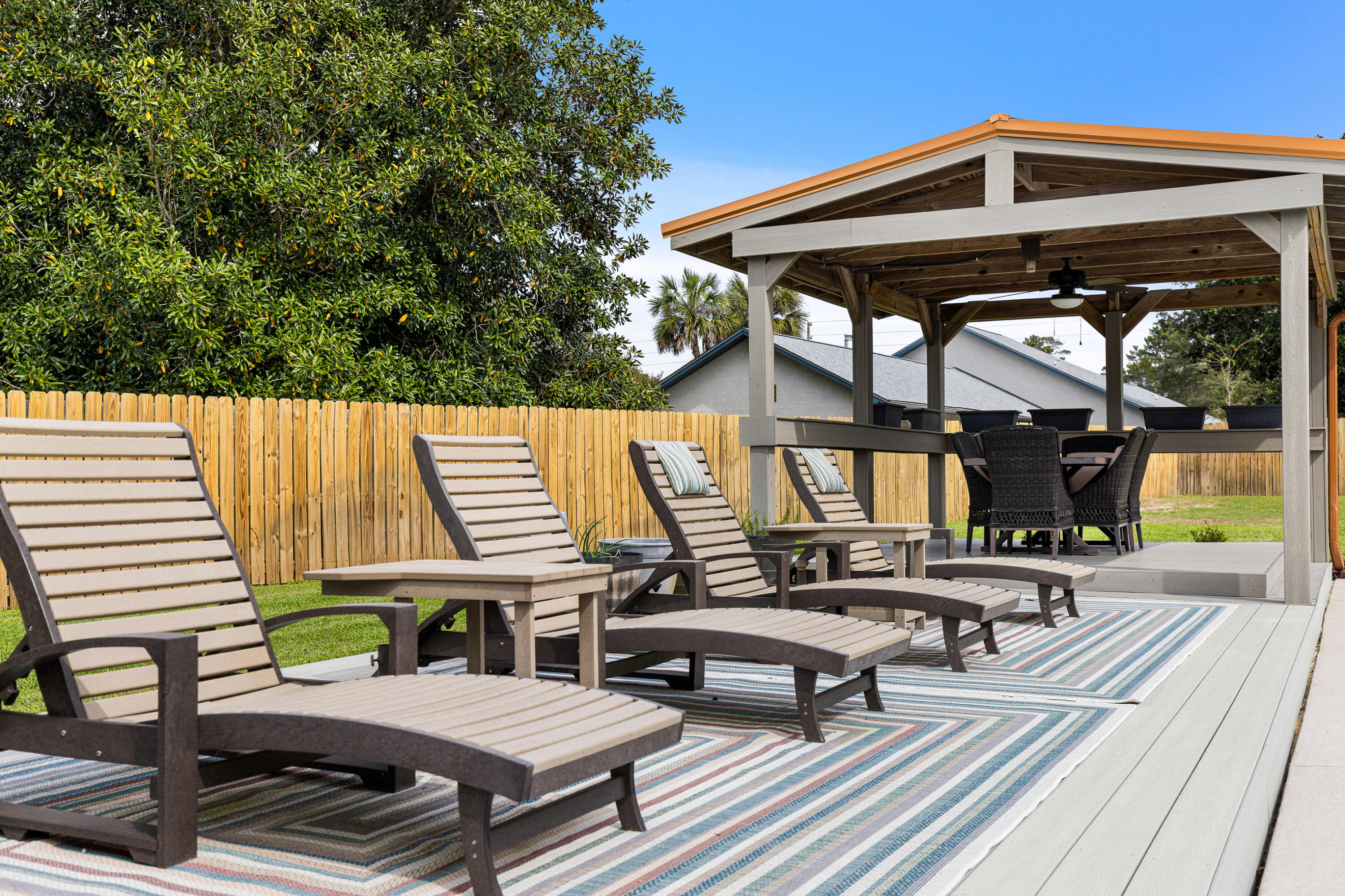 804 Mars Street Destin, FL 32541 - Photo 48 of 71 a view of a patio with couple of chairs and a fire pit