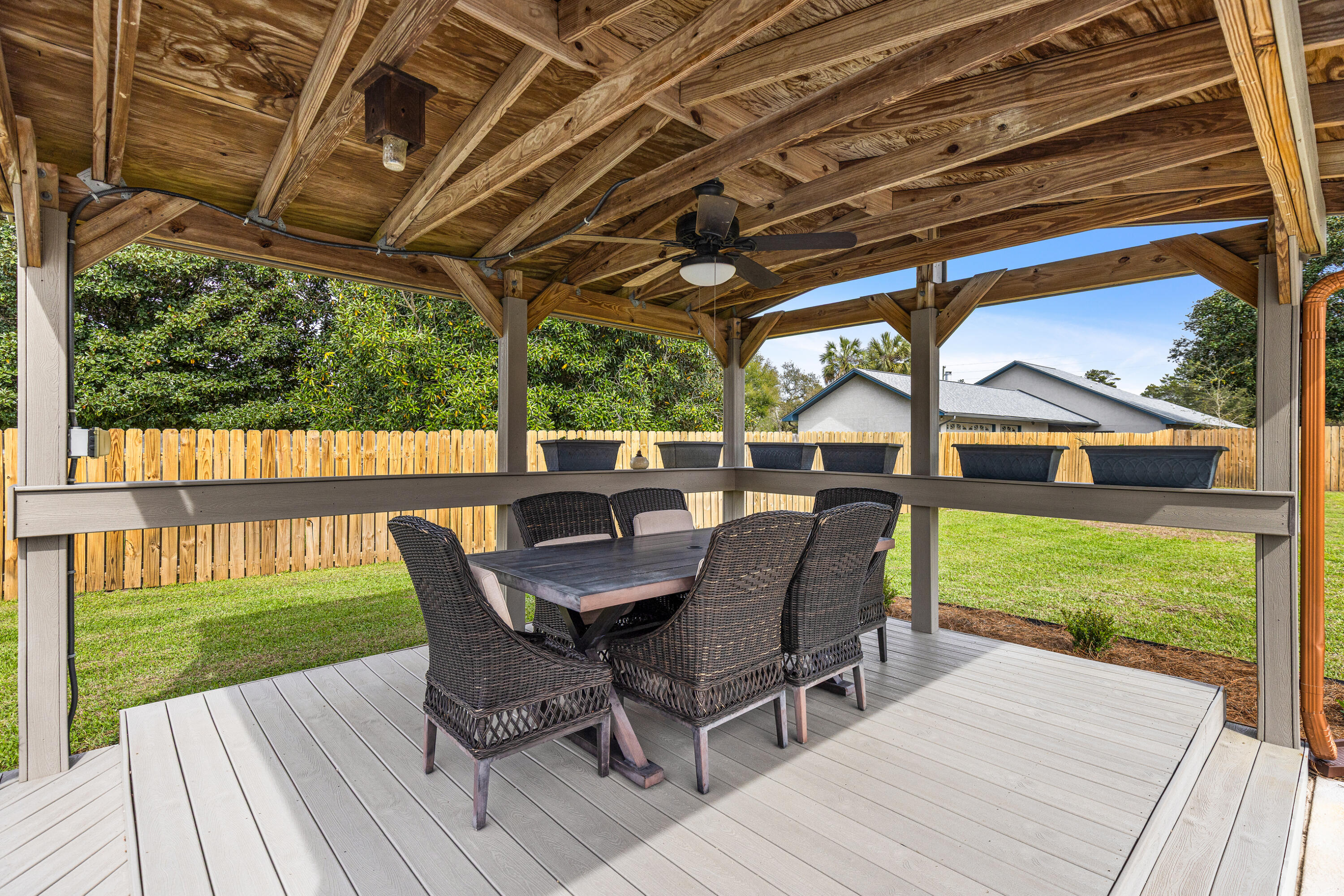 804 Mars Street Destin, FL 32541 - Photo 49 of 71 a view of a patio with a table chairs and a backyard
