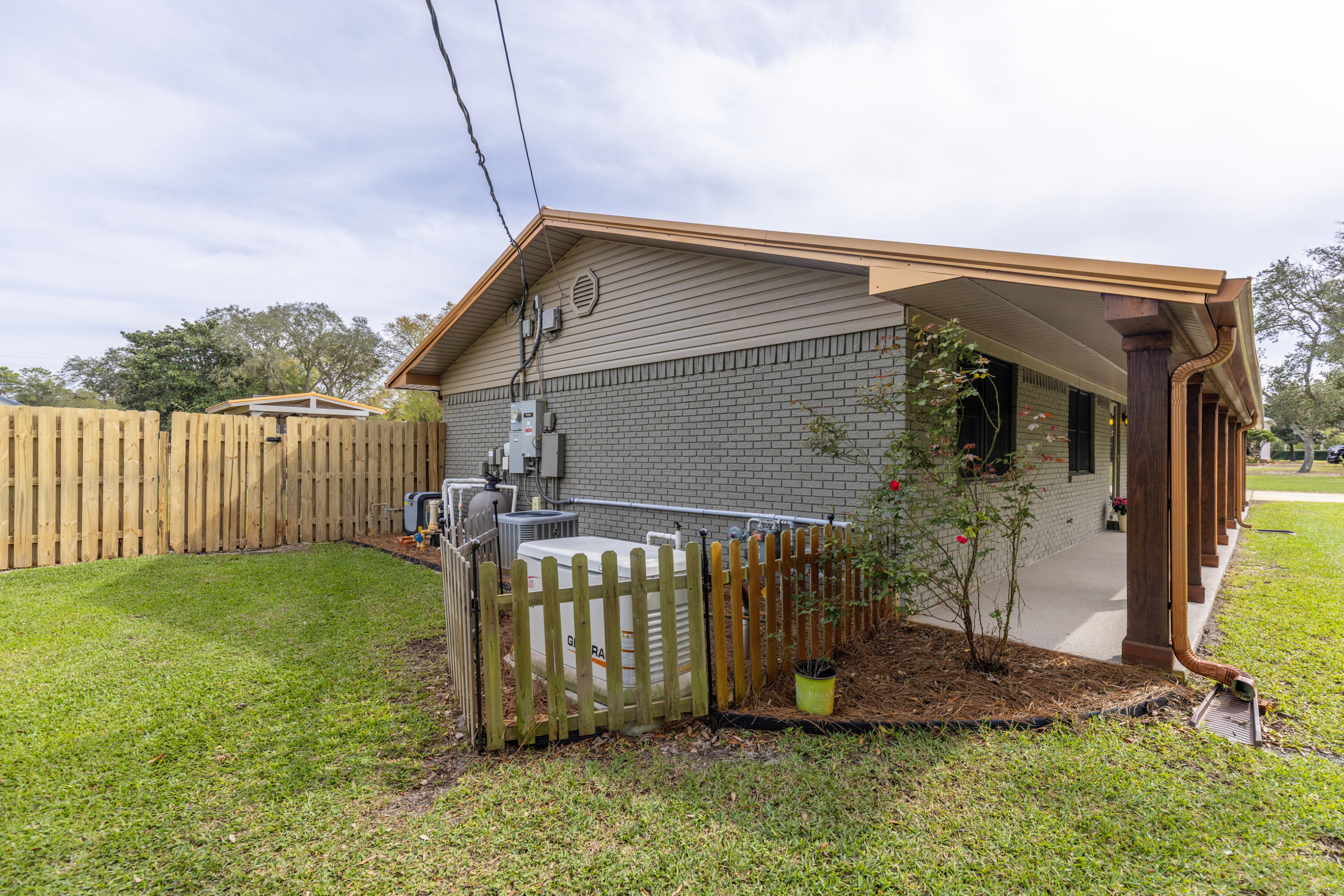 804 Mars Street Destin, FL 32541 - Photo 52 of 71 a front view of a house having yard