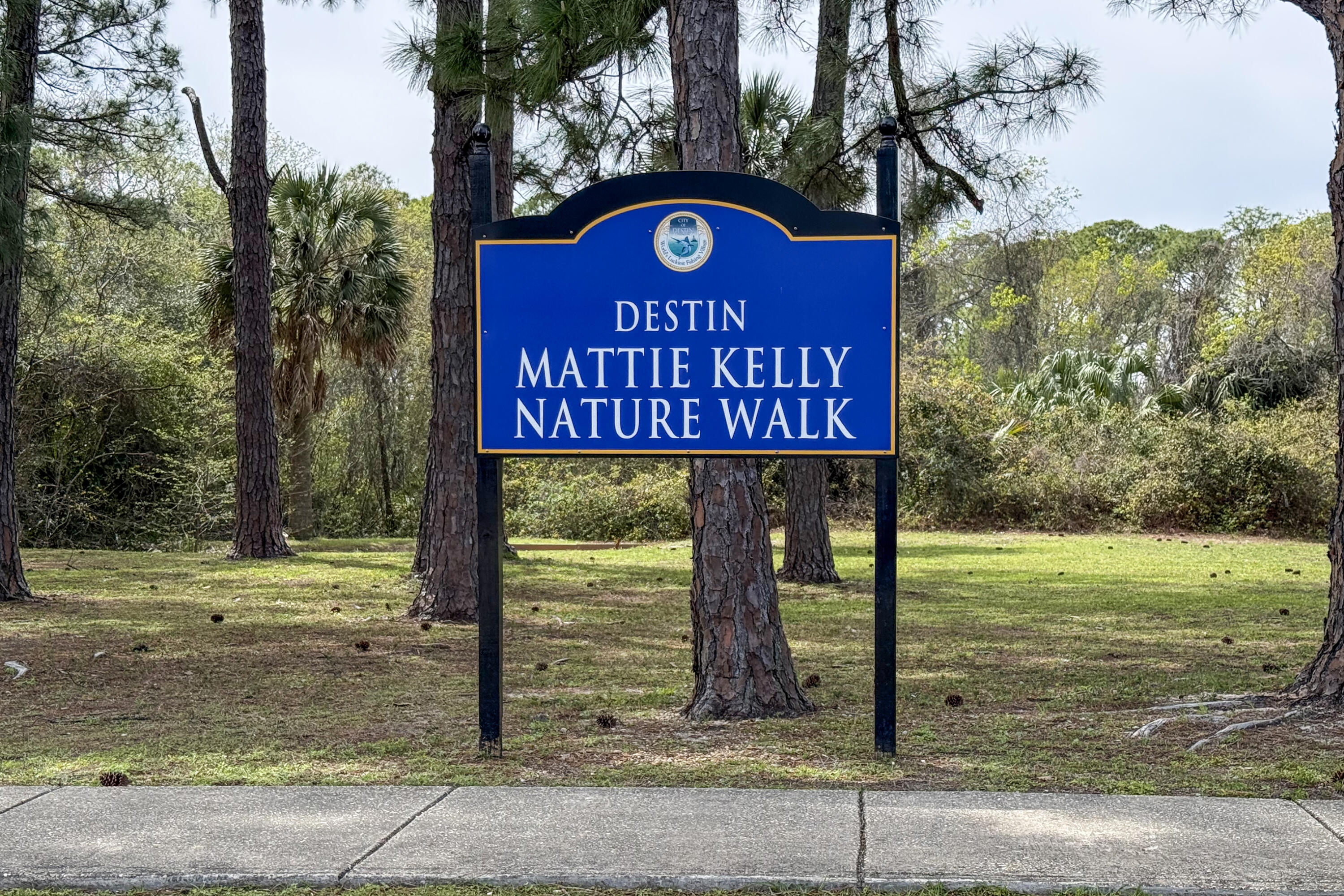 804 Mars Street Destin, FL 32541 - Photo 67 of 71 a sign board with a small yard