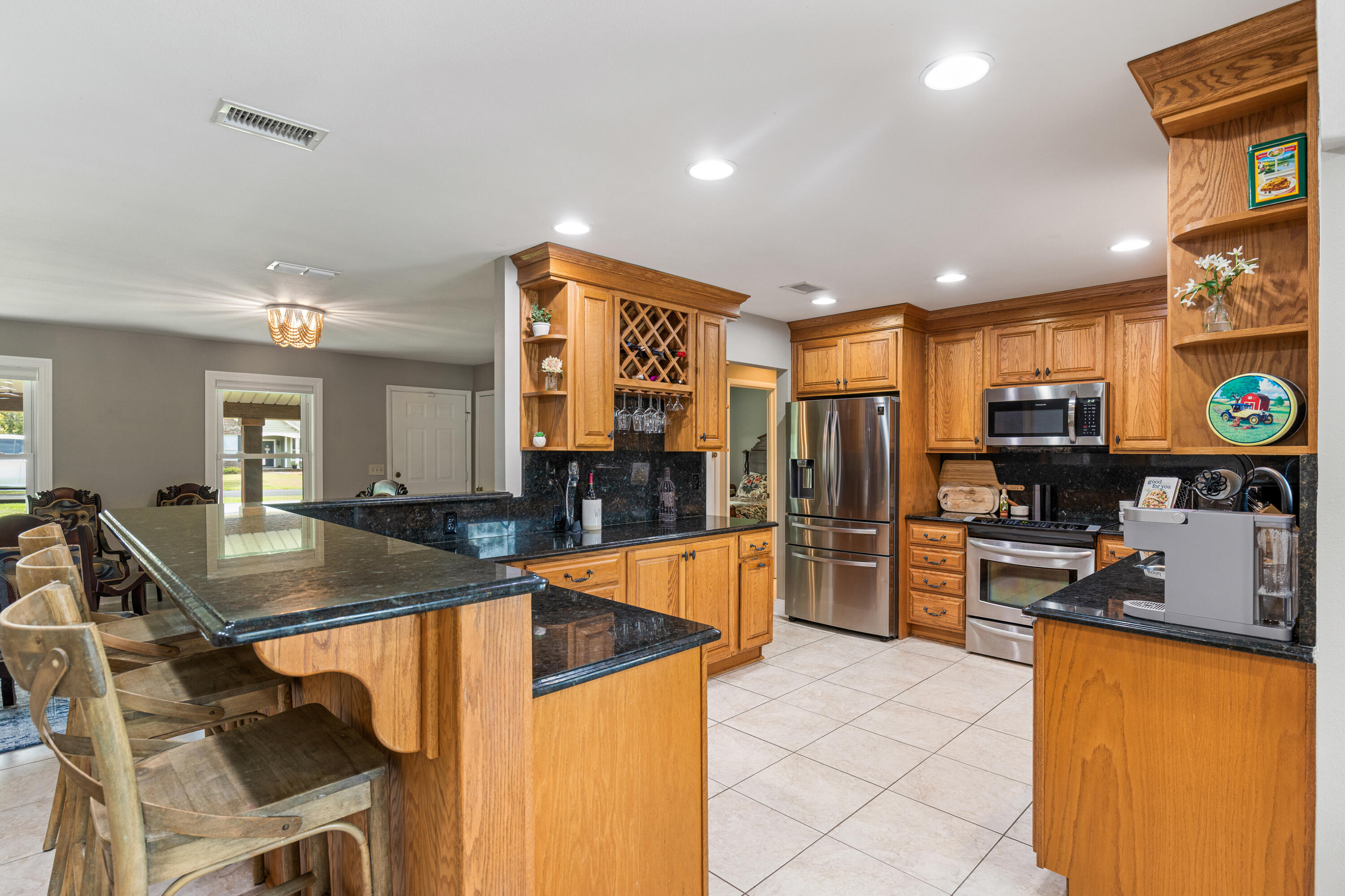 804 Mars Street Destin, FL 32541 - Photo 8 of 71 a kitchen with stainless steel appliances granite countertop a sink refrigerator and microwave
