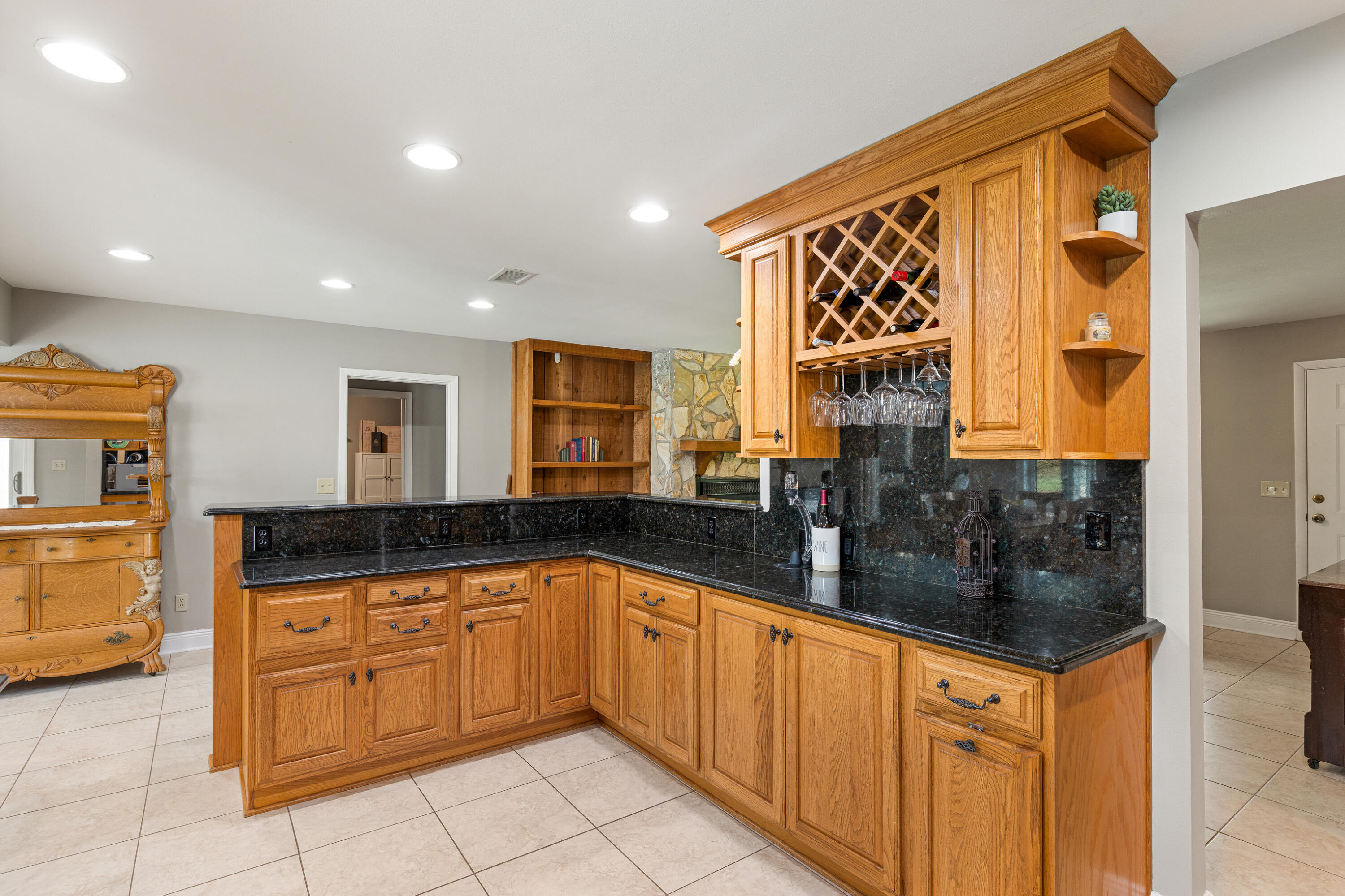 804 Mars Street Destin, FL 32541 - Photo 10 of 71 a kitchen with granite countertop a sink and cabinets