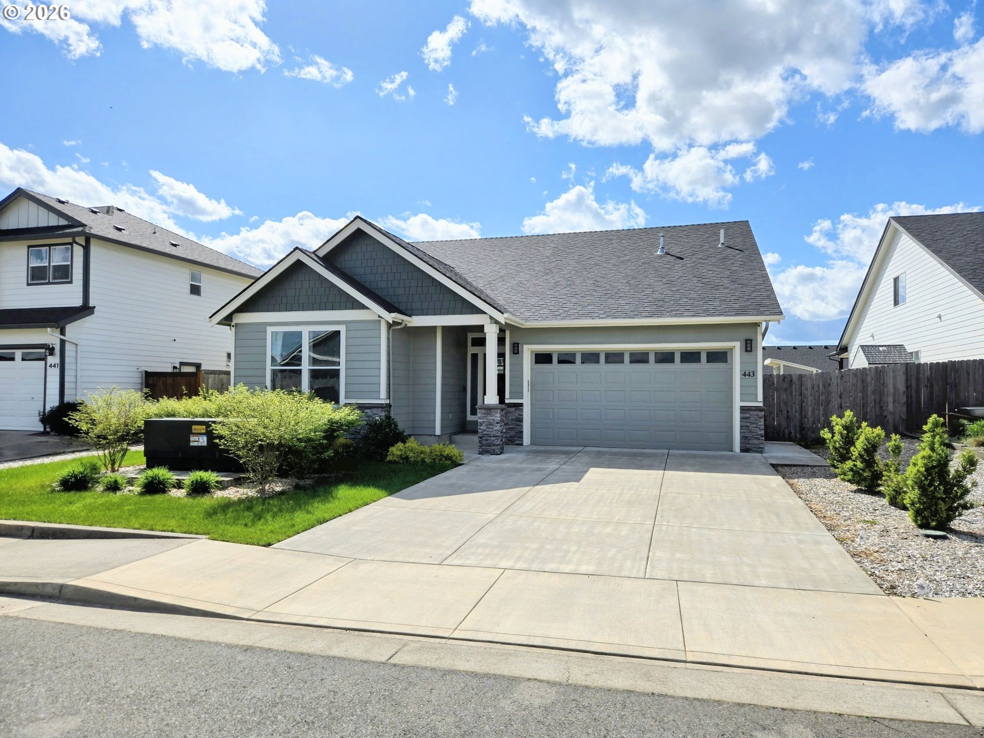 443 Northeast Pine Street Sublimity, OR 97385 - Photo 1 of 26 a front view of a house with a yard and garage