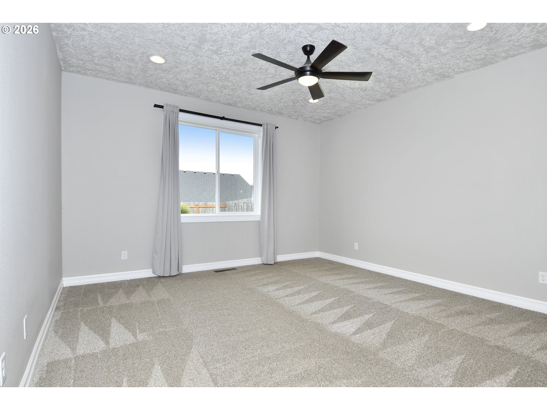 443 Northeast Pine Street Sublimity, OR 97385 - Photo 12 of 26 a view of empty room with wooden floor and fan