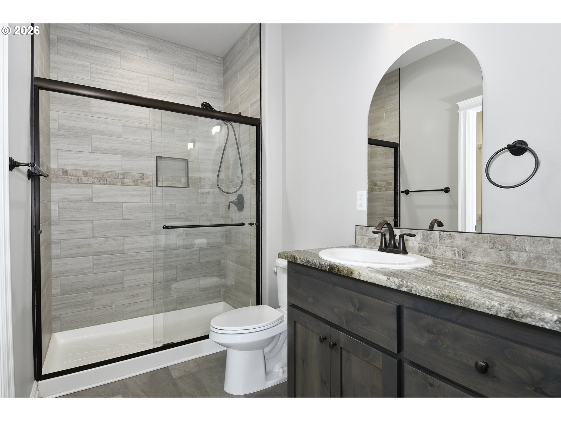443 Northeast Pine Street Sublimity, OR 97385 - Photo 13 of 26 a bathroom with a granite countertop sink mirror vanity and toilet