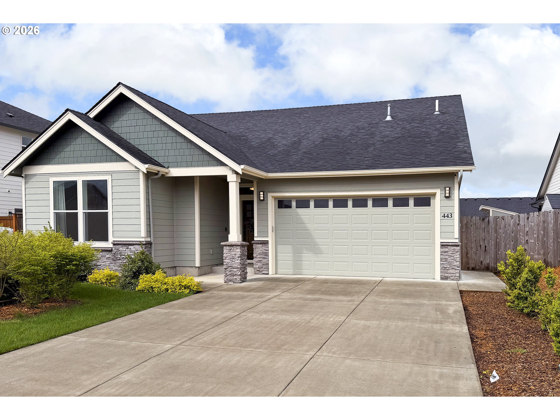 443 Northeast Pine Street Sublimity, OR 97385 - Photo 2 of 26 a front view of a house with garden