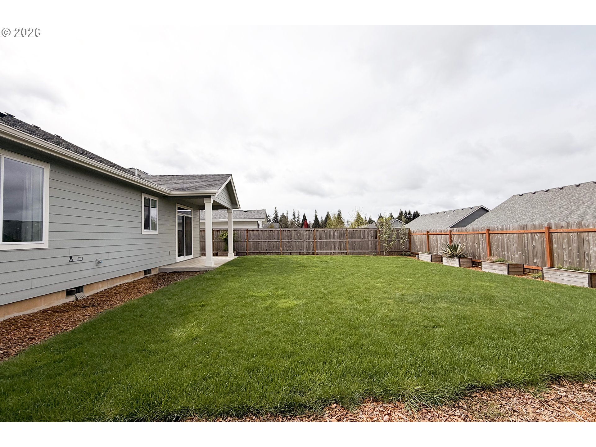443 Northeast Pine Street Sublimity, OR 97385 - Photo 21 of 26 a view of a house with a backyard