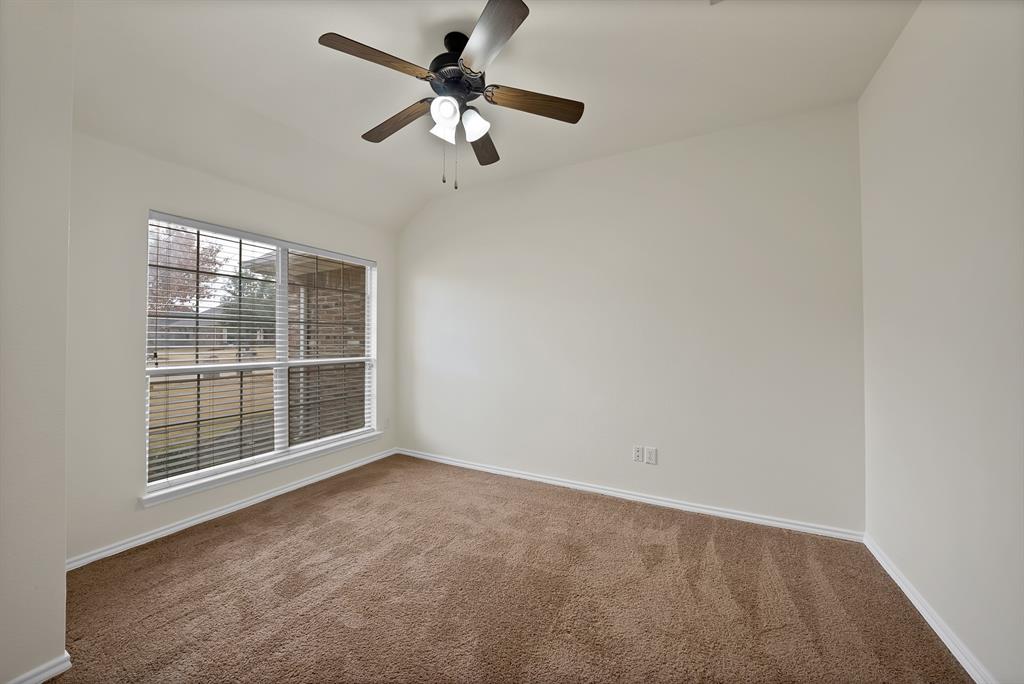 2832 Lone Ranger Trail Little Elm, TX 75068 - Photo 12 of 35 an empty room with windows and fan