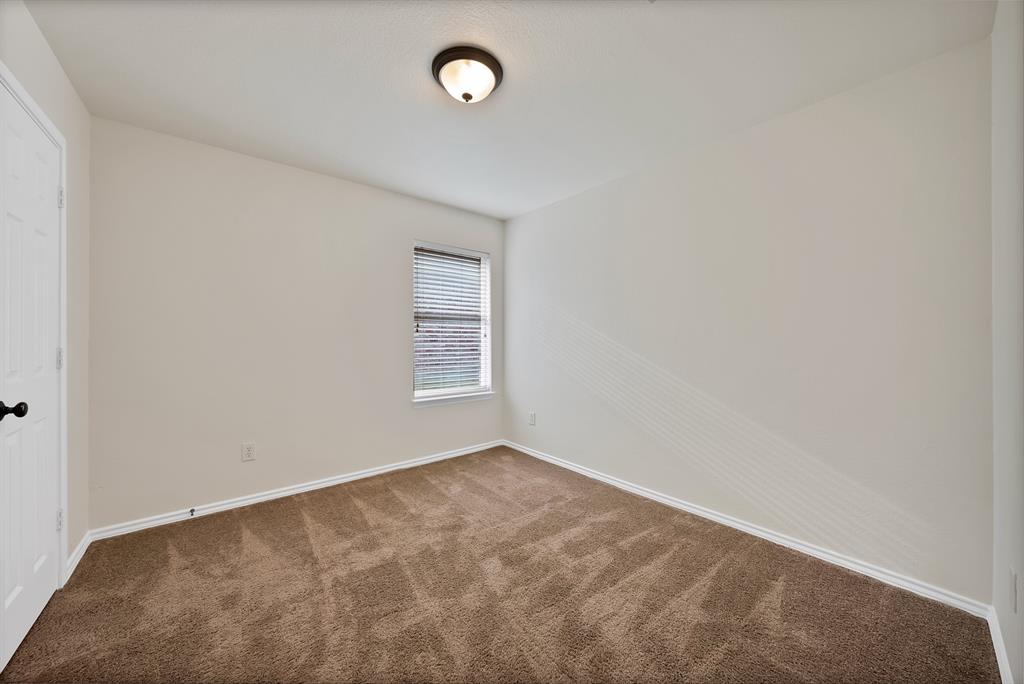 2832 Lone Ranger Trail Little Elm, TX 75068 - Photo 23 of 35 an empty room with windows