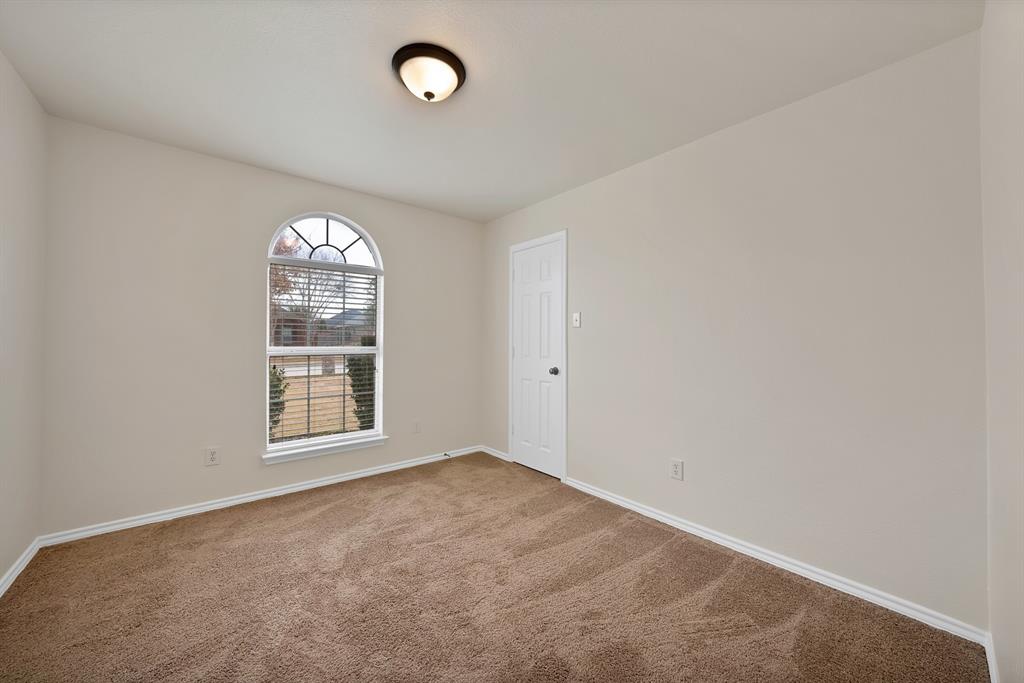 2832 Lone Ranger Trail Little Elm, TX 75068 - Photo 25 of 35 an empty room with a window