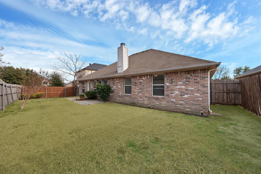 2832 Lone Ranger Trail Little Elm, TX 75068 - Photo 30 of 35 a front view of a house with a garden