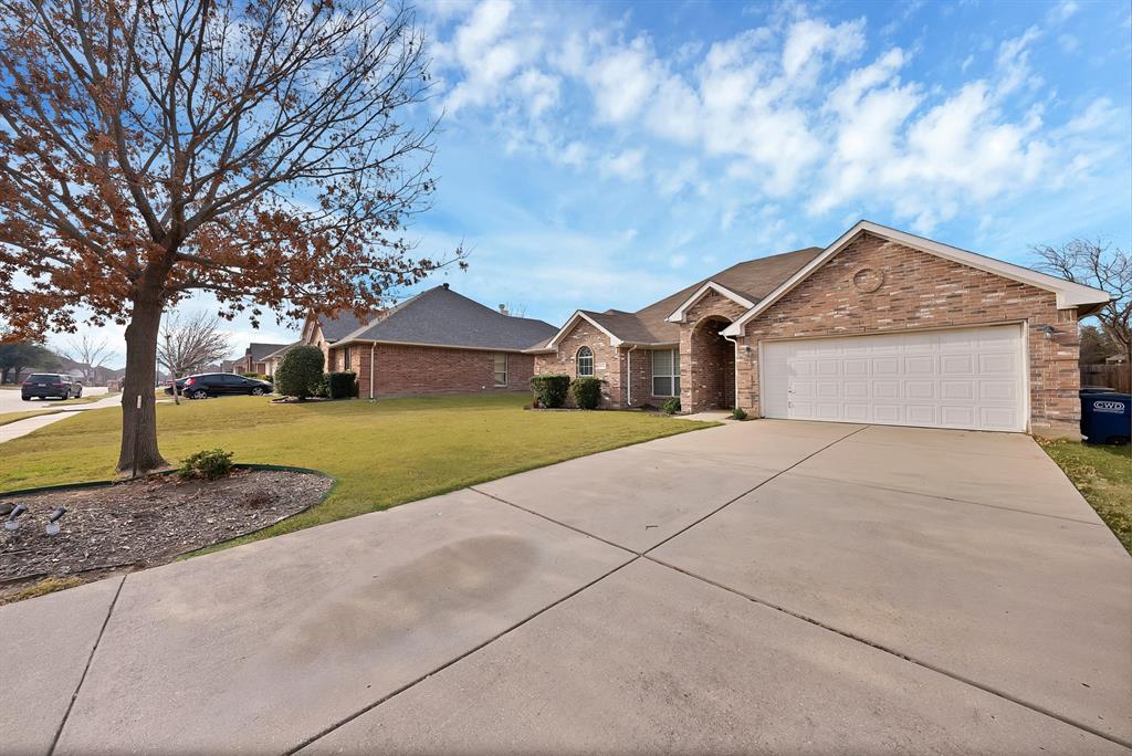 2832 Lone Ranger Trail Little Elm, TX 75068 - Photo 4 of 35 a front view of a house with a yard and trees