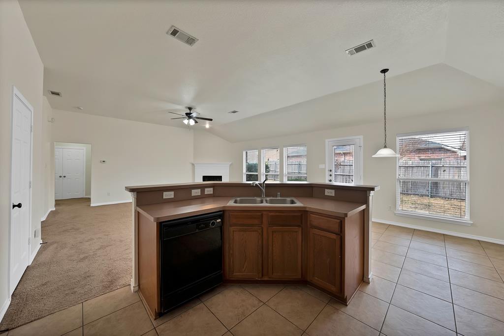 2832 Lone Ranger Trail Little Elm, TX 75068 - Photo 7 of 35 a kitchen with a sink and cabinets
