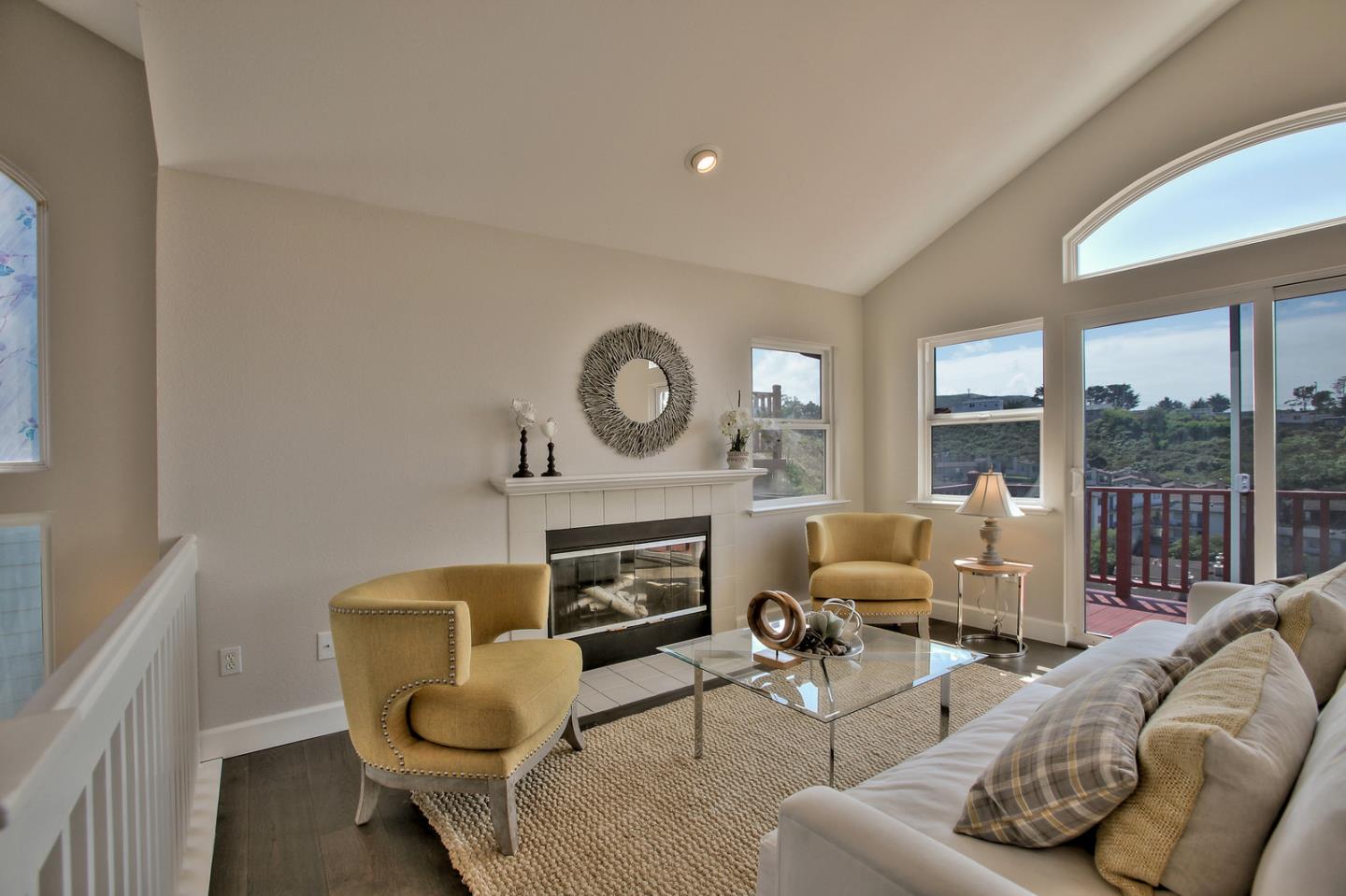 518 A Monterey Road Pacifica, CA 94044 - Photo 1 of 41 a living room with furniture a large window and a fireplace