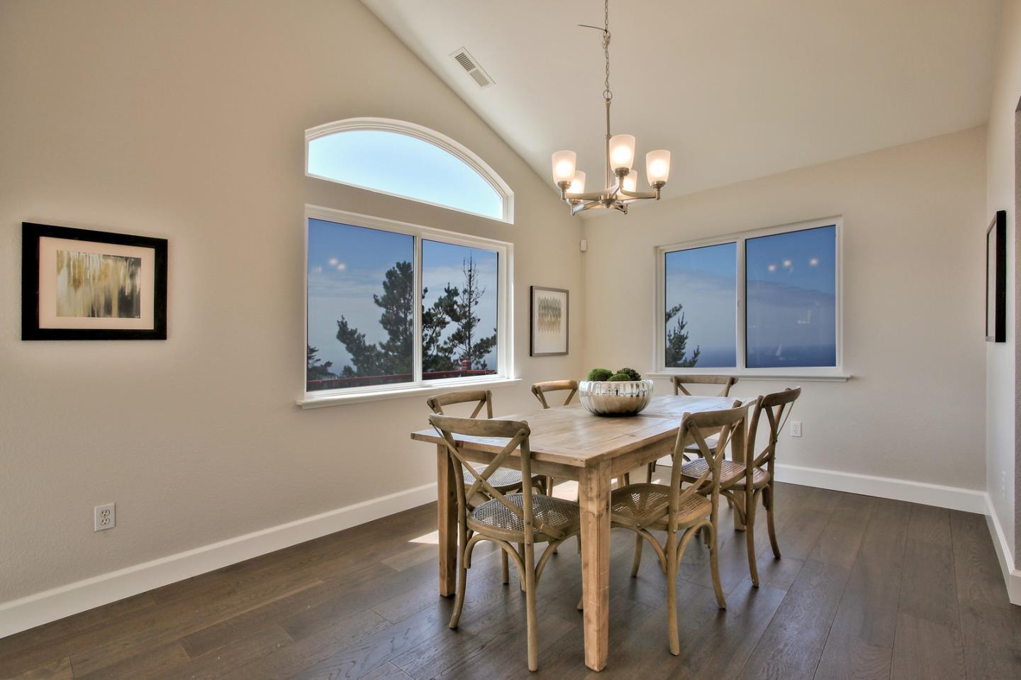 518 A Monterey Road Pacifica, CA 94044 - Photo 13 of 41 a view of a dining room with furniture a chandelier and wooden floor