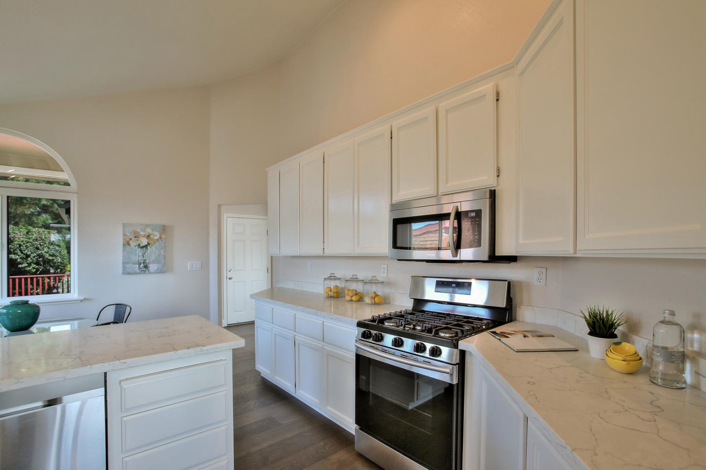 518 A Monterey Road Pacifica, CA 94044 - Photo 15 of 41 a kitchen with cabinets appliances a sink and a window