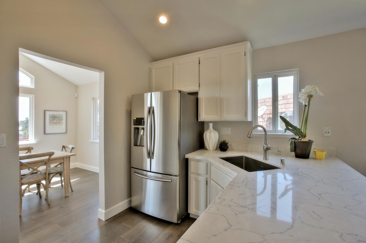 518 A Monterey Road Pacifica, CA 94044 - Photo 16 of 41 a kitchen with stainless steel appliances a refrigerator and a stove top oven