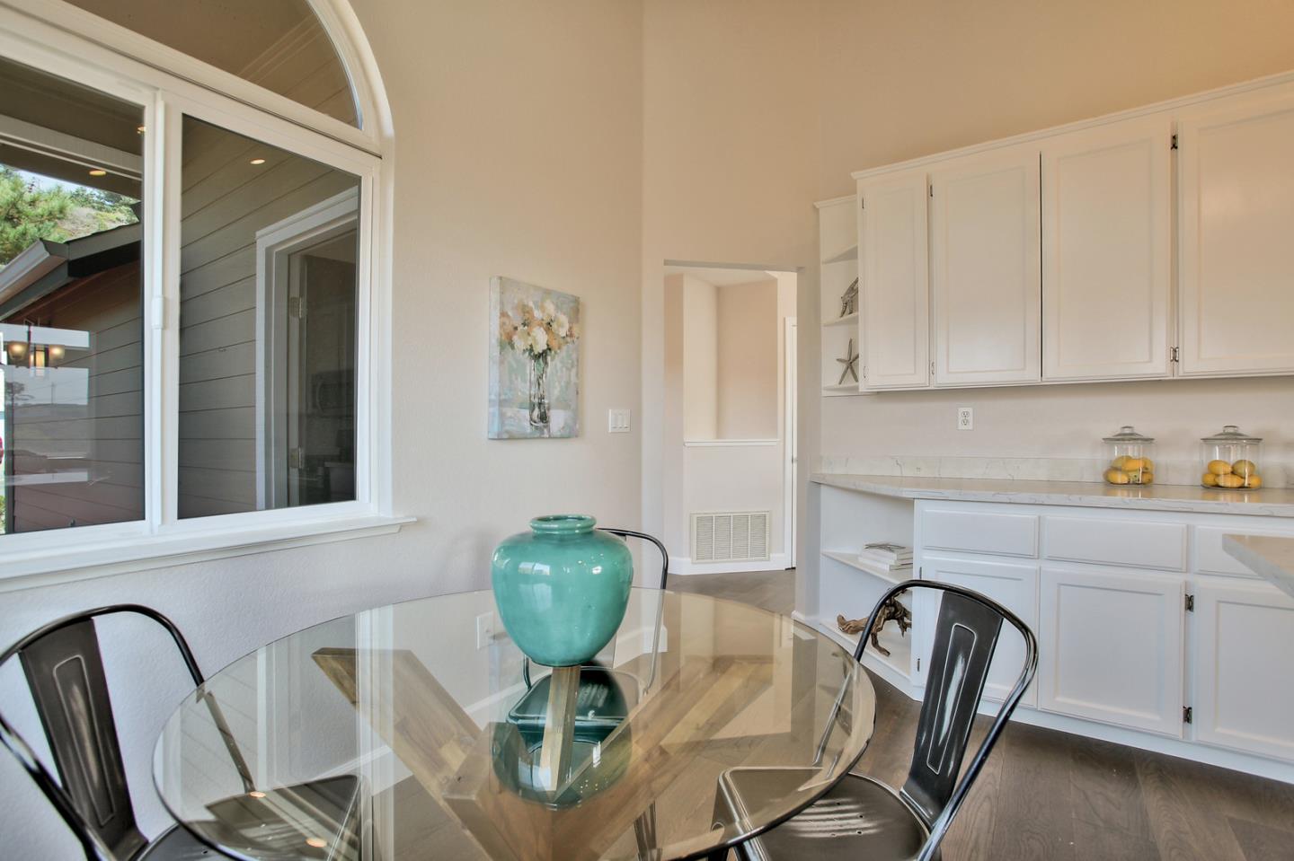 518 A Monterey Road Pacifica, CA 94044 - Photo 19 of 41 a view of a dining room that has a table and chairs