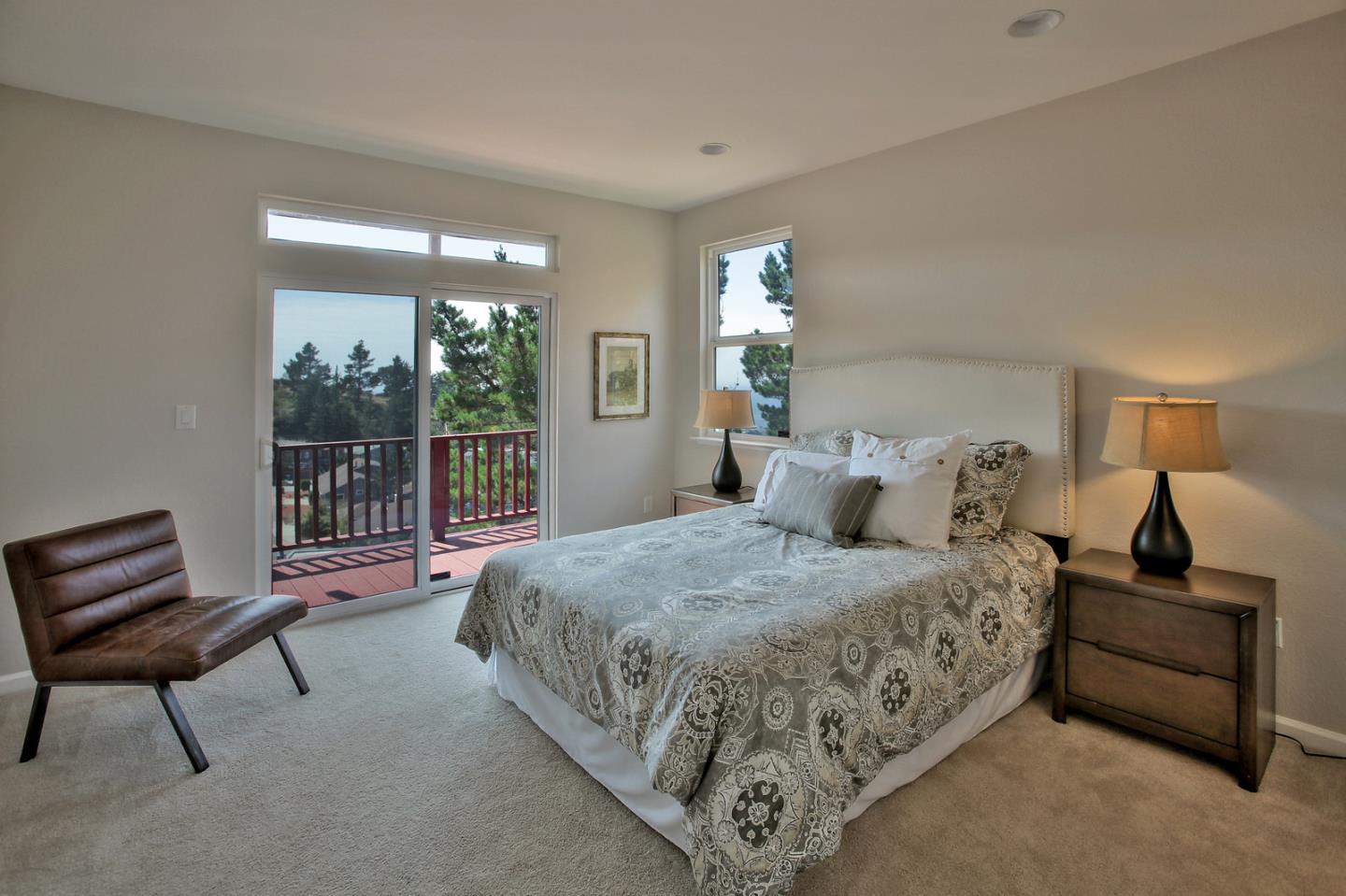 518 A Monterey Road Pacifica, CA 94044 - Photo 22 of 41 a bedroom with a bed and a dresser next to it