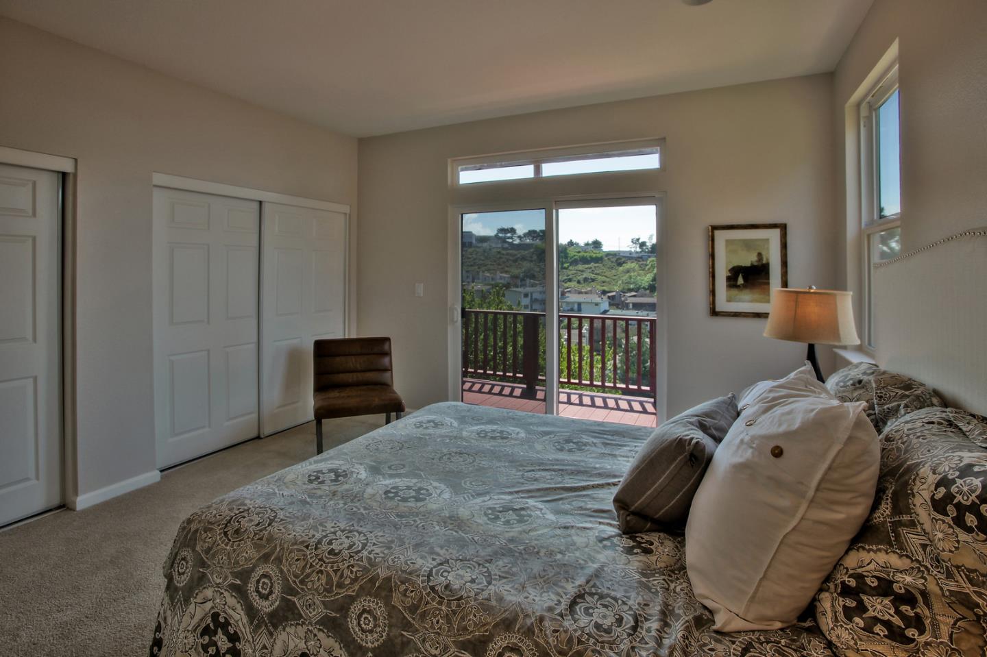 518 A Monterey Road Pacifica, CA 94044 - Photo 23 of 41 a bedroom with a bed and a window