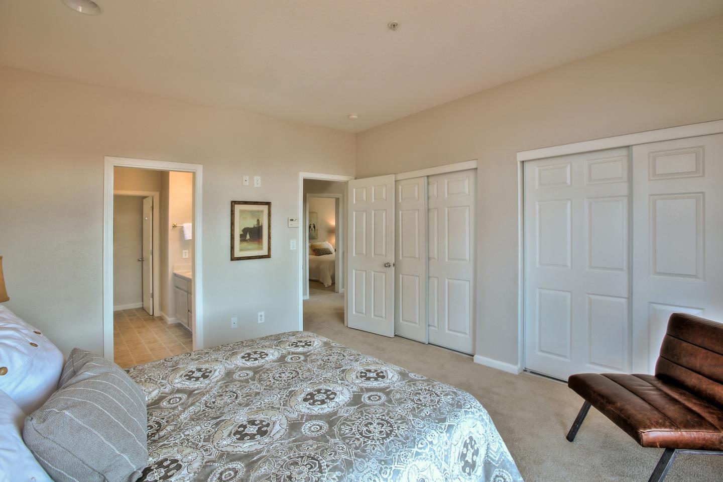 518 A Monterey Road Pacifica, CA 94044 - Photo 24 of 41 a bedroom with a bed and wooden floor