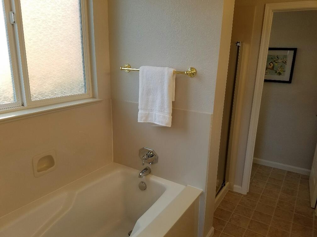 518 A Monterey Road Pacifica, CA 94044 - Photo 26 of 41 a bathroom with a tub and a window