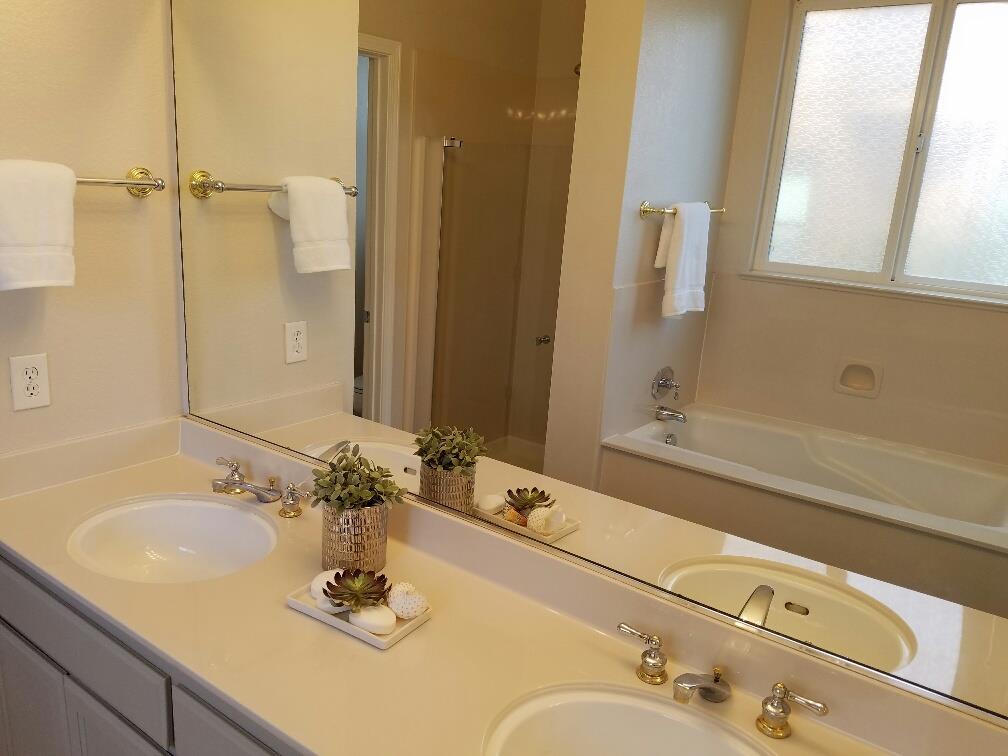 518 A Monterey Road Pacifica, CA 94044 - Photo 27 of 41 a bathroom with a granite countertop sink and a mirror a bathtub