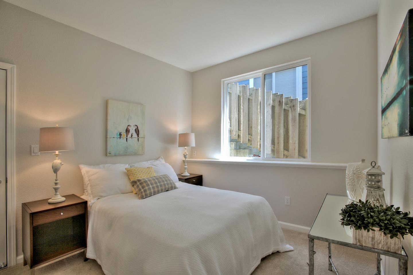 518 A Monterey Road Pacifica, CA 94044 - Photo 29 of 41 a bedroom with a bed and a potted plant