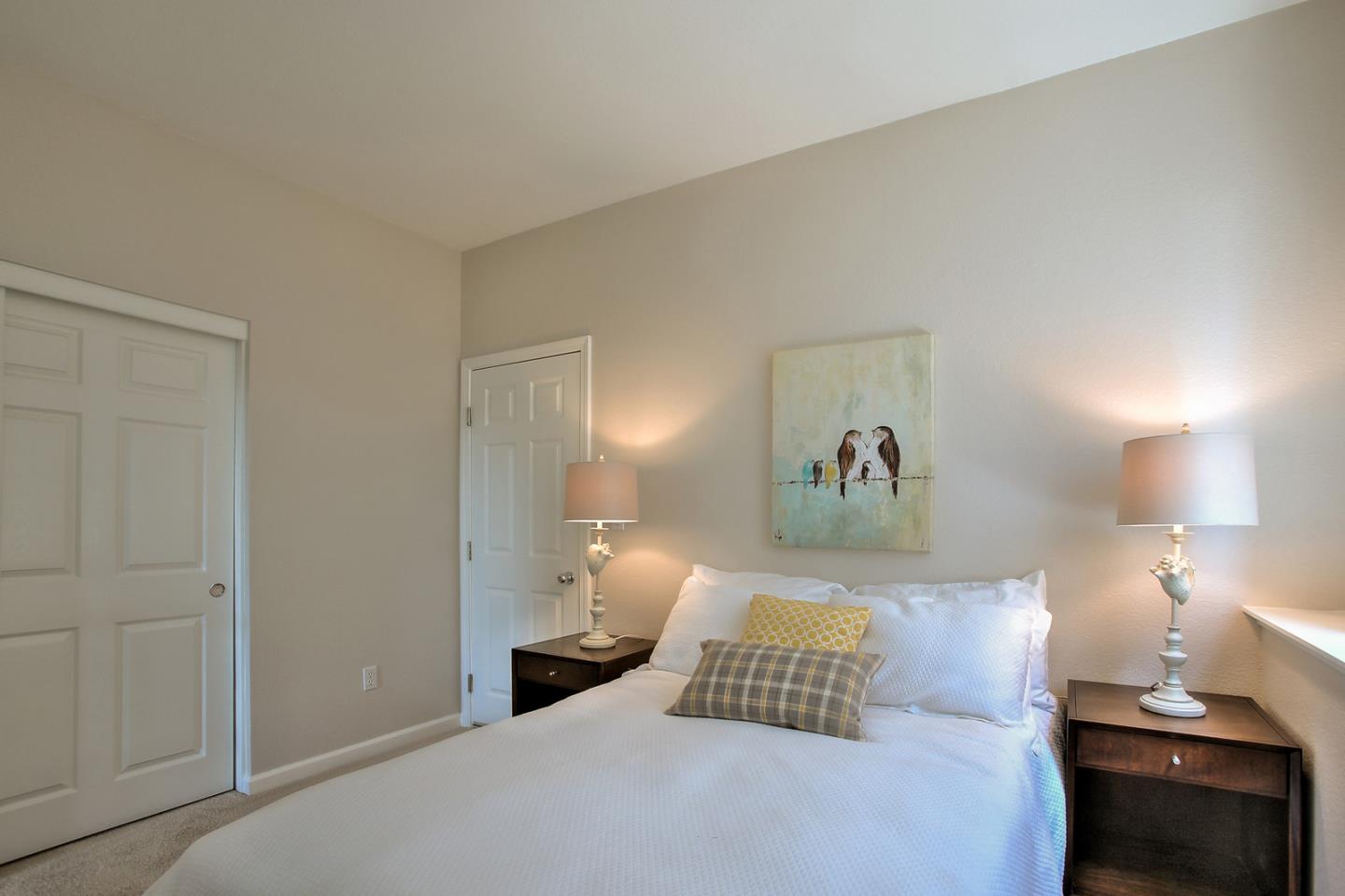 518 A Monterey Road Pacifica, CA 94044 - Photo 31 of 41 a bedroom with a bed and a lamp