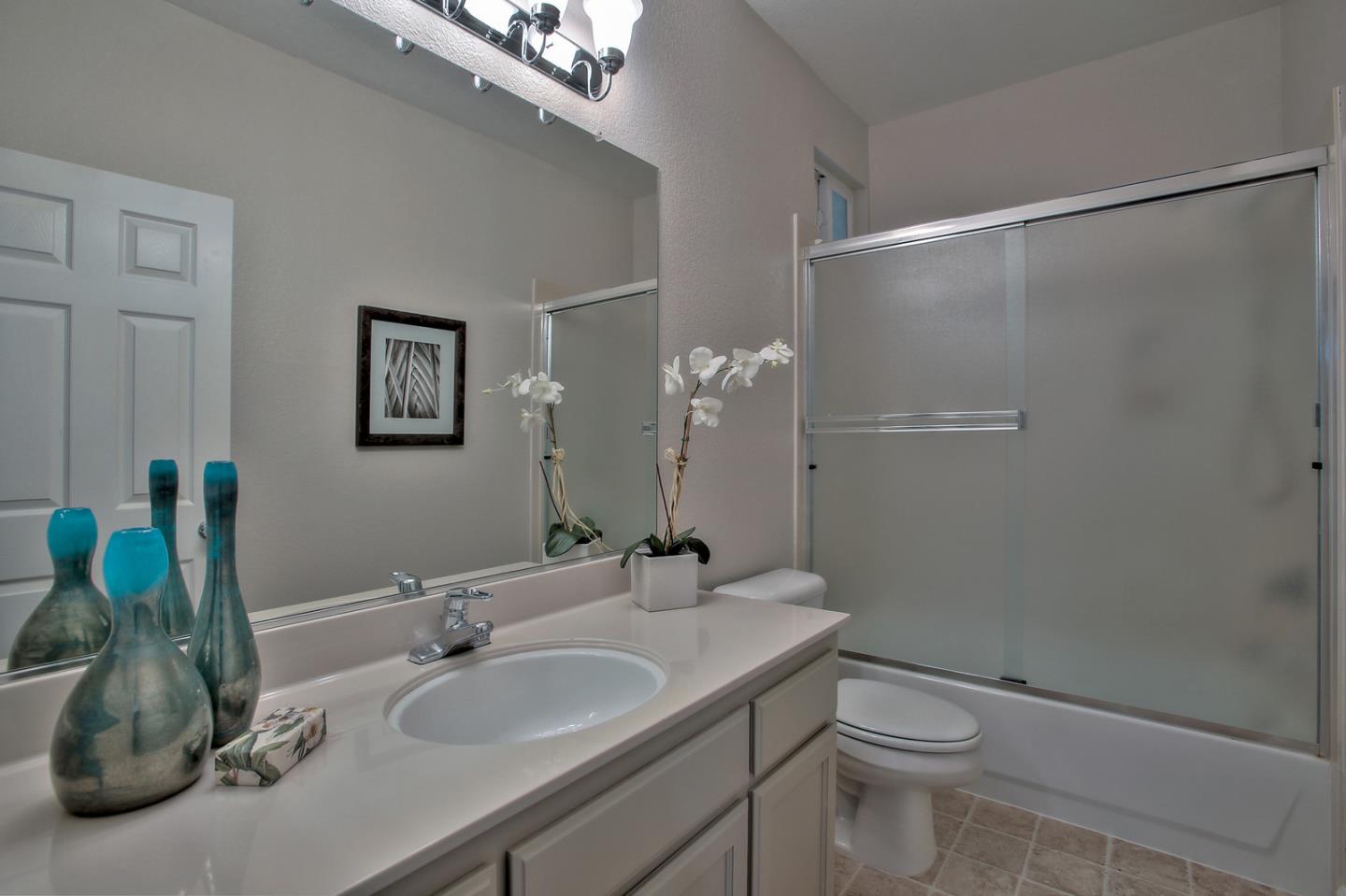 518 A Monterey Road Pacifica, CA 94044 - Photo 35 of 41 a bathroom with a granite countertop sink a toilet and a mirror
