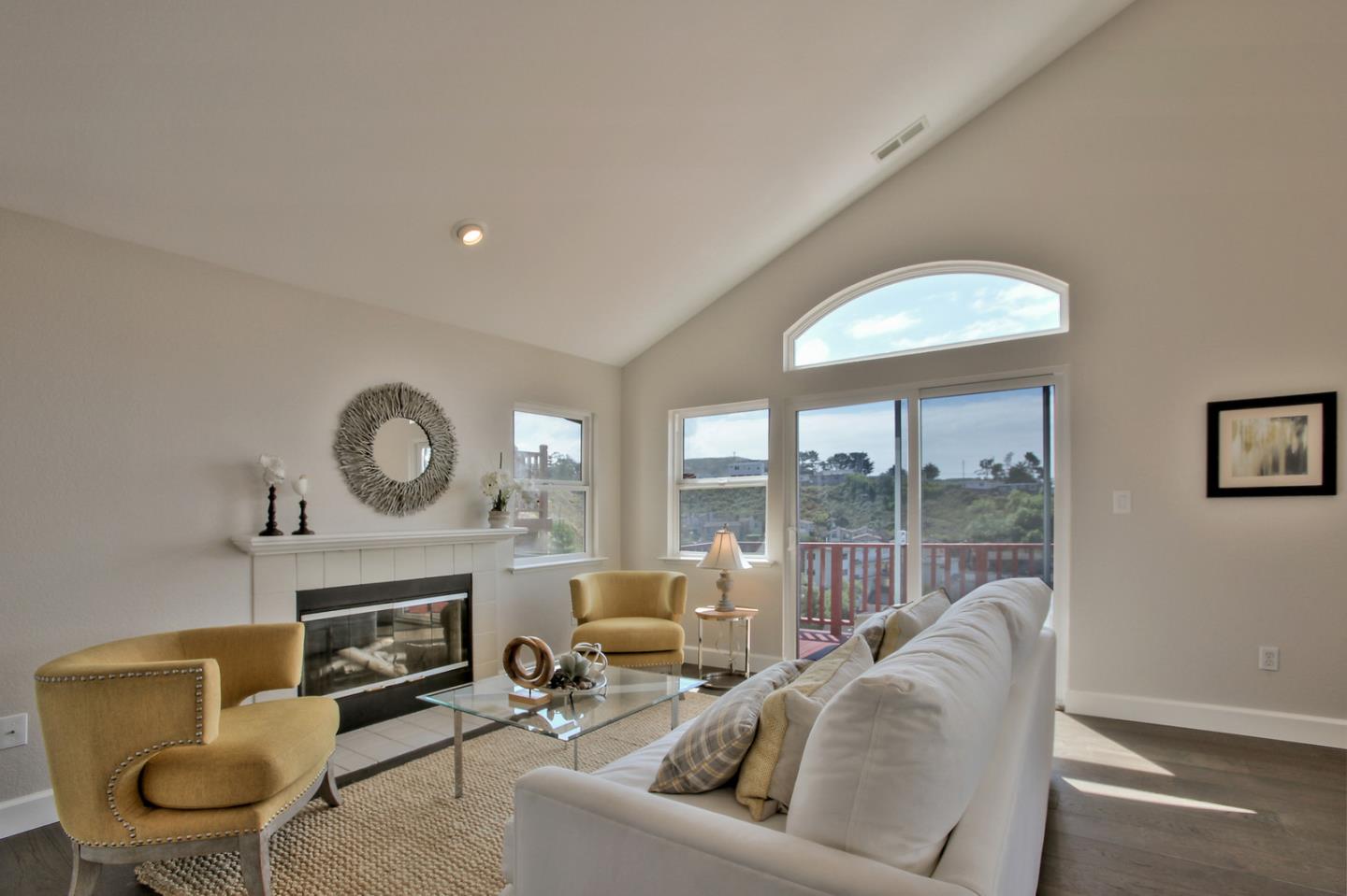 518 A Monterey Road Pacifica, CA 94044 - Photo 7 of 41 a living room with furniture a fireplace and a large window