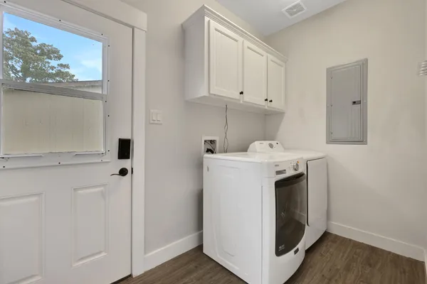 a kitchen with stainless steel appliances granite countertop a sink and cabinets