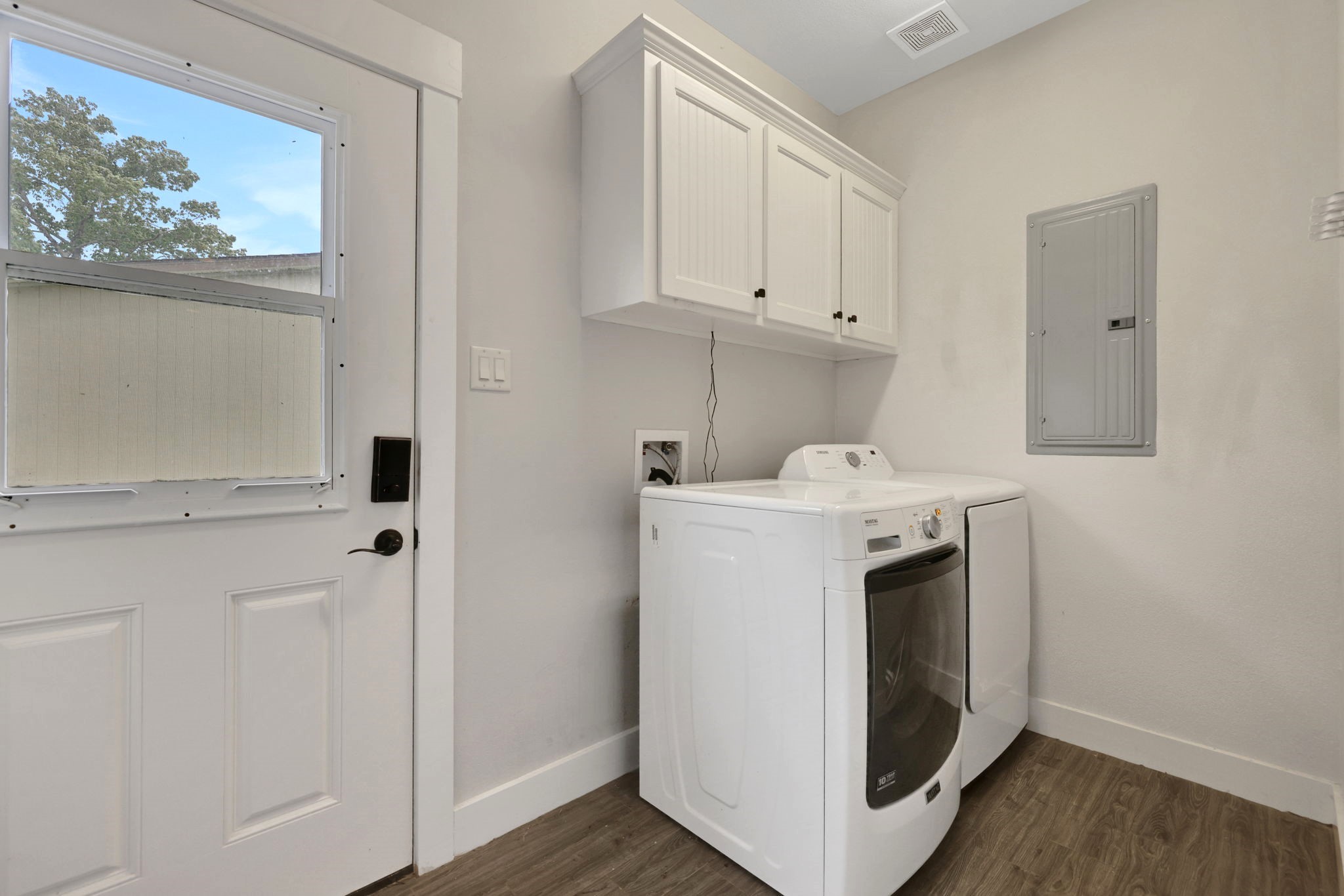 453 East Oak Shadows Onalaska, TX 77360 - Photo 18 of 48 Laundry room with access to outside. Has a storage closet on opposite wall.