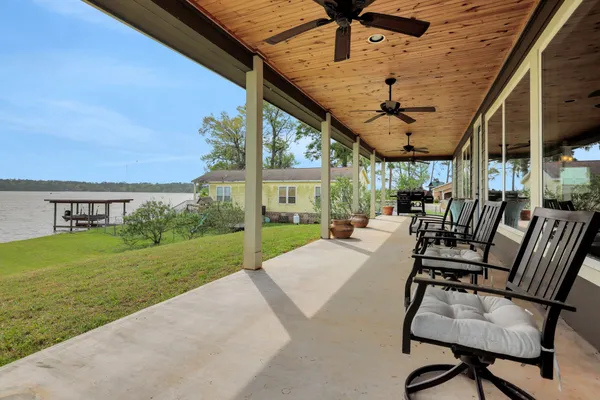 a view of a swimming pool and lounge chairs