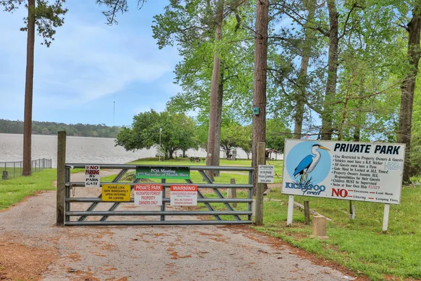 a view of outside space with wooden floor and lake view