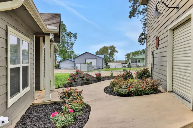 a front view of a house with garden