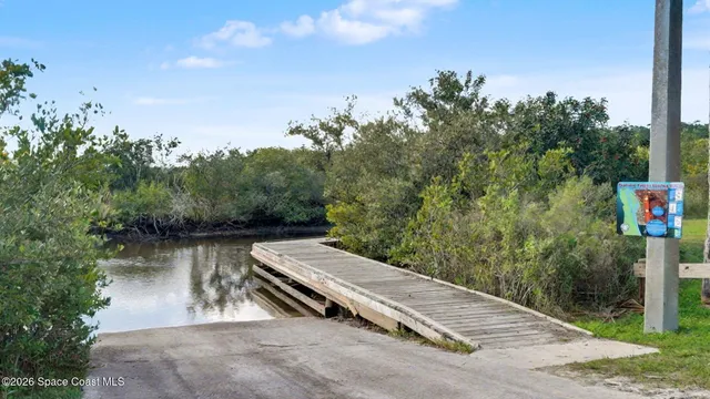 a view of a wooden deck with lake view