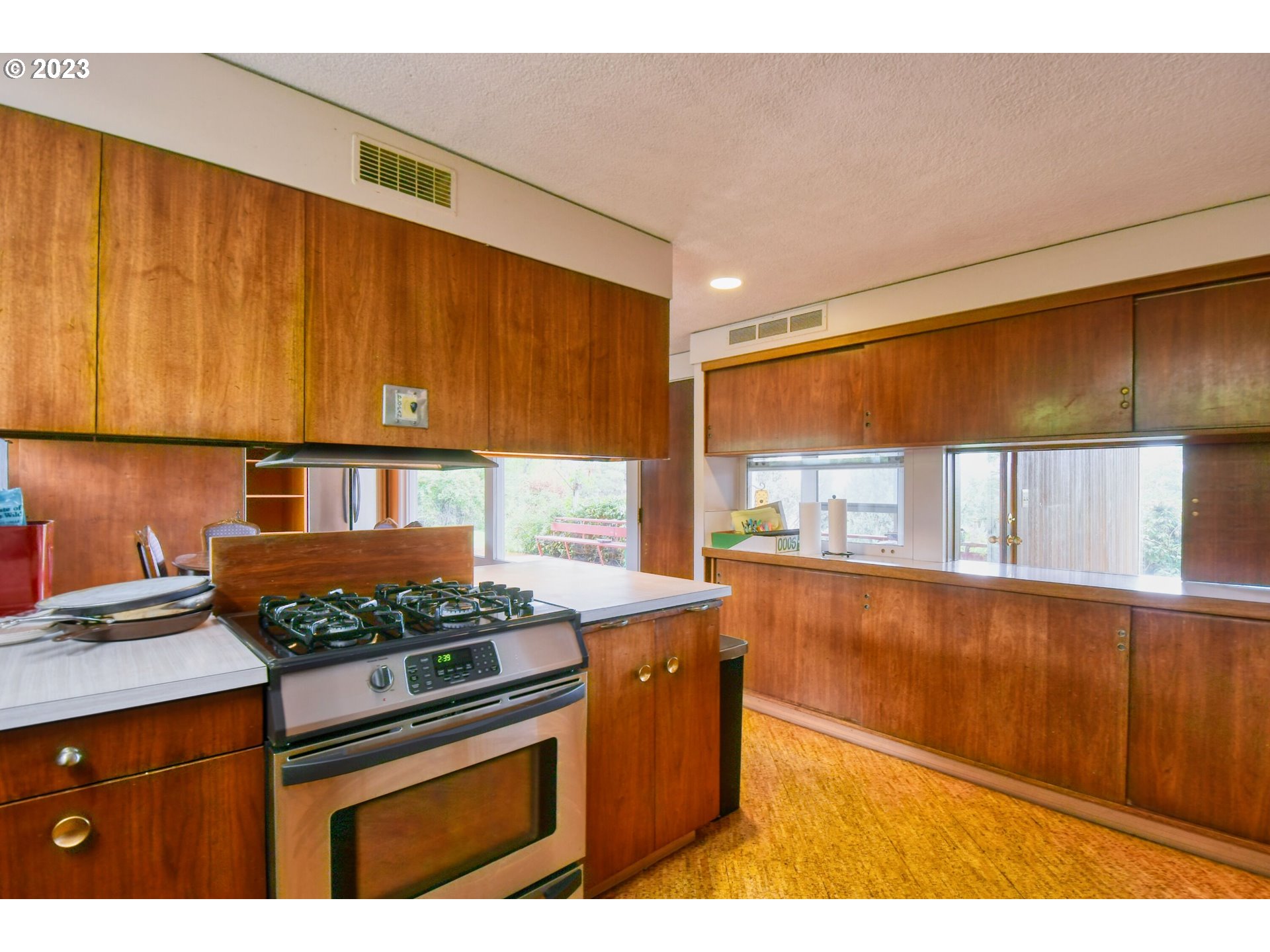 1042 Skyline Drive Pendleton, OR 97801 - Photo 11 of 48 a kitchen with stainless steel appliances granite countertop a stove a sink and a microwave