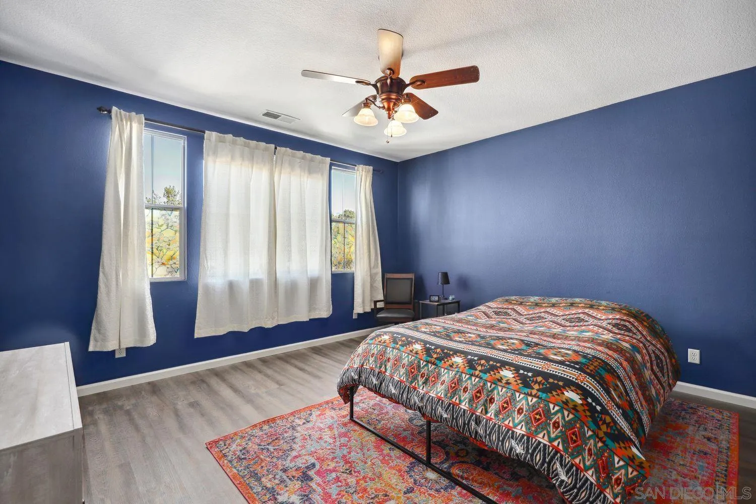 1166 Midnight Way Oceanside, CA 92057 - Photo 15 of 37 a bedroom with a large bed and a window