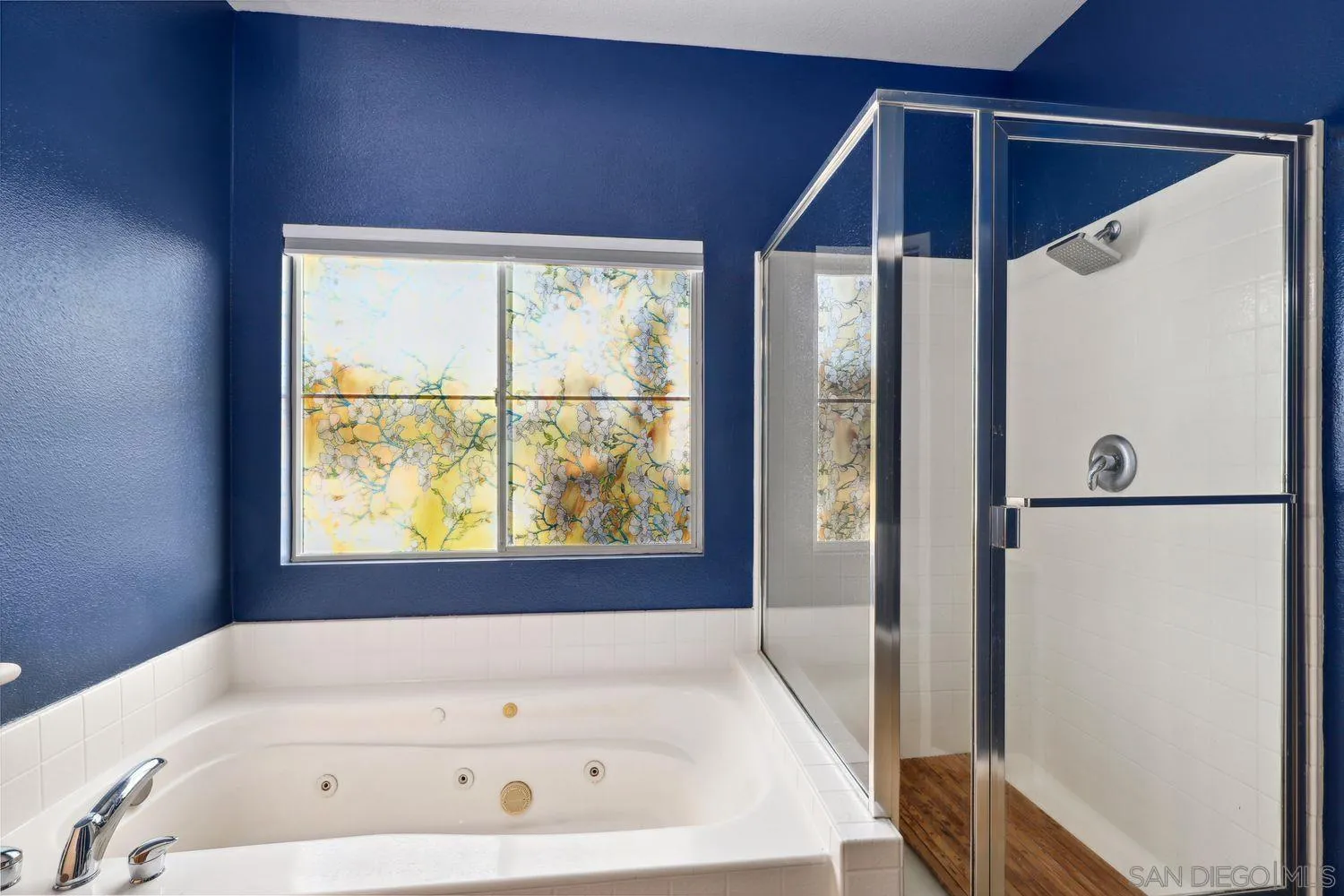 1166 Midnight Way Oceanside, CA 92057 - Photo 18 of 37 a bathroom with a bathtub and a shower