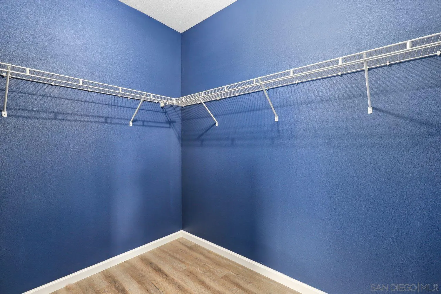 1166 Midnight Way Oceanside, CA 92057 - Photo 19 of 37 a view of a room with racks on the wall
