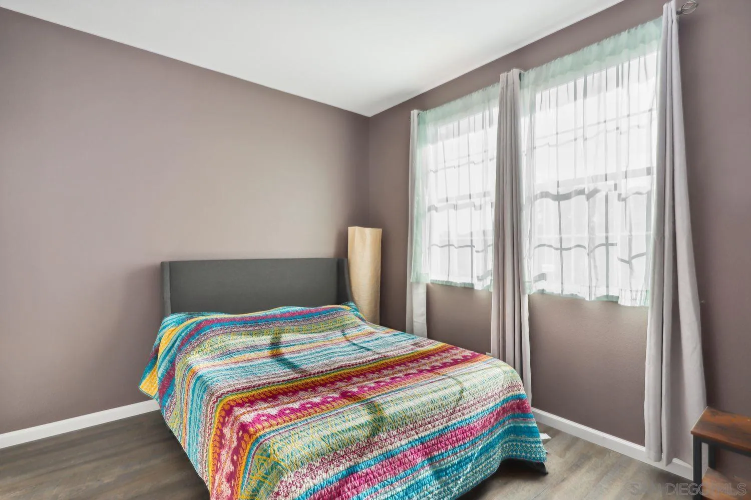 1166 Midnight Way Oceanside, CA 92057 - Photo 20 of 37 a bedroom with a bed and a window