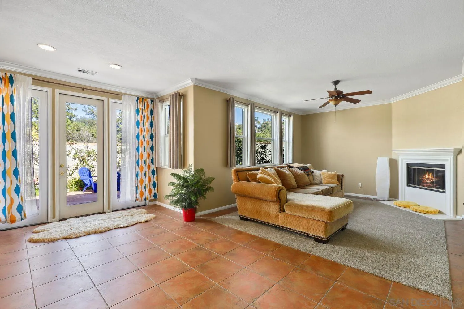 1166 Midnight Way Oceanside, CA 92057 - Photo 2 of 37 a living room with furniture and a fireplace