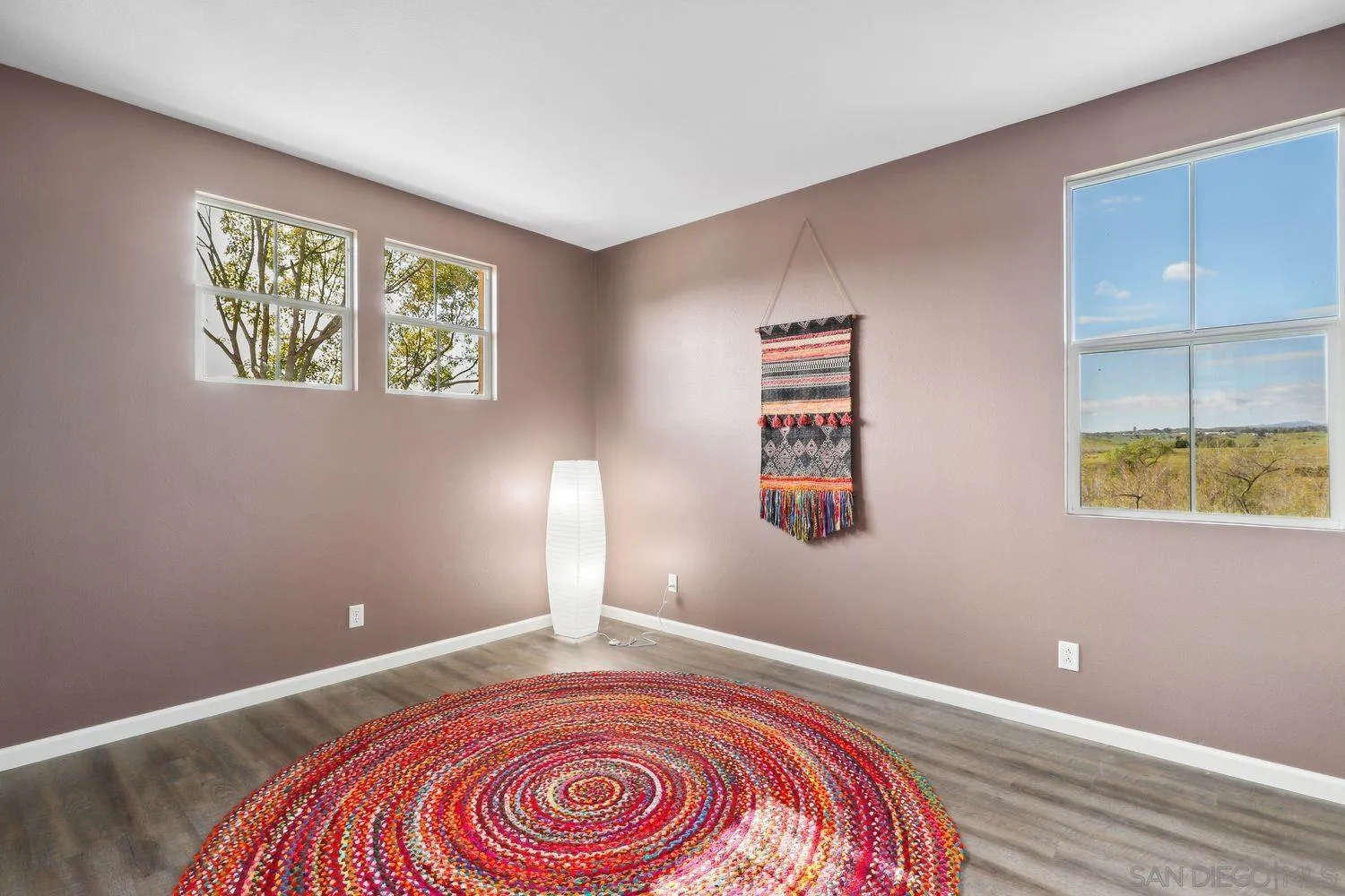 1166 Midnight Way Oceanside, CA 92057 - Photo 22 of 37 a view of room with window and wooden floor