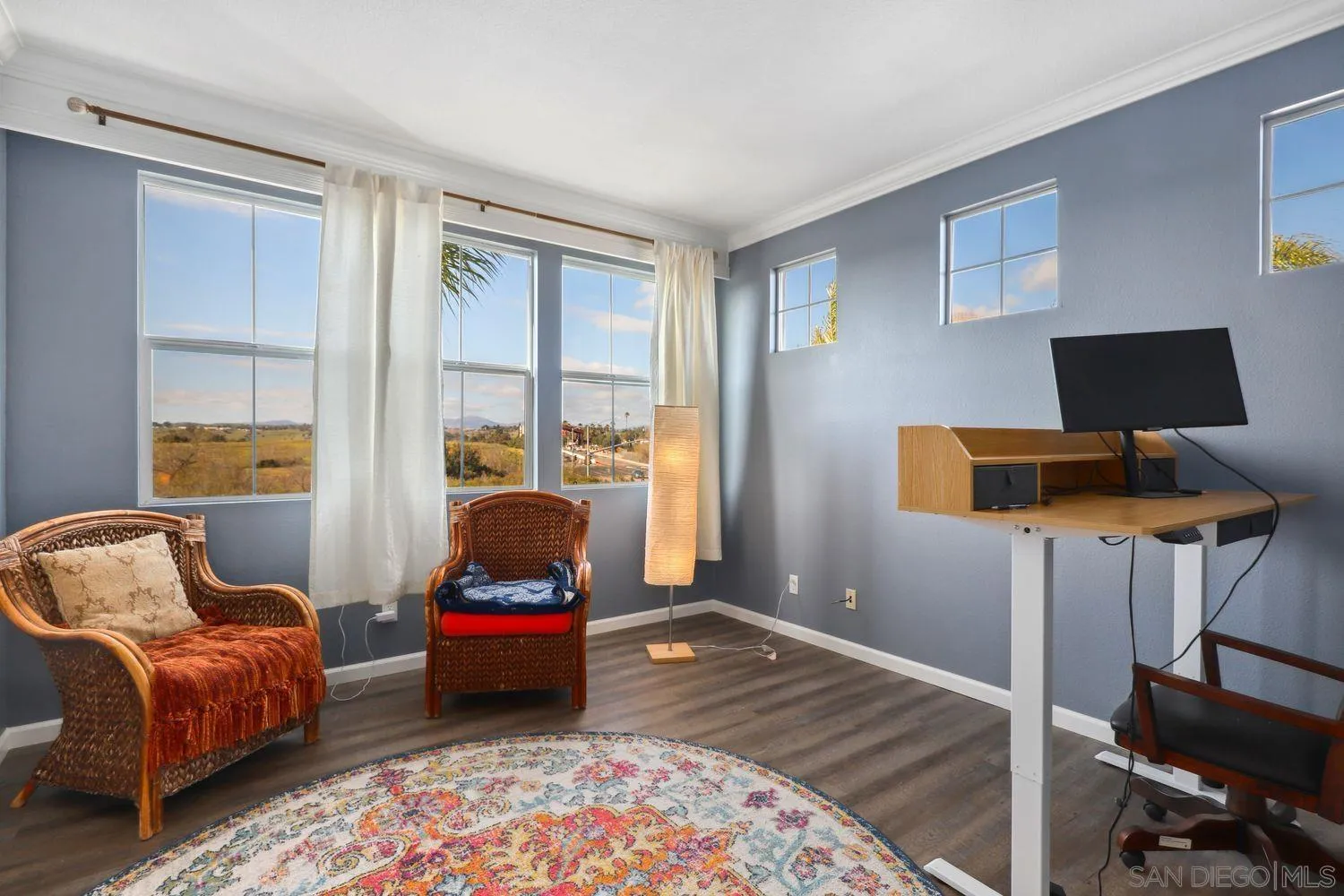 1166 Midnight Way Oceanside, CA 92057 - Photo 23 of 37 a bedroom with a bed and wooden floor