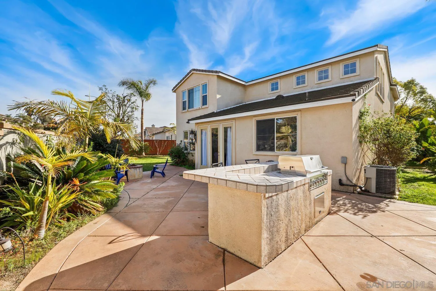 1166 Midnight Way Oceanside, CA 92057 - Photo 24 of 37 a front view of a house with a garden